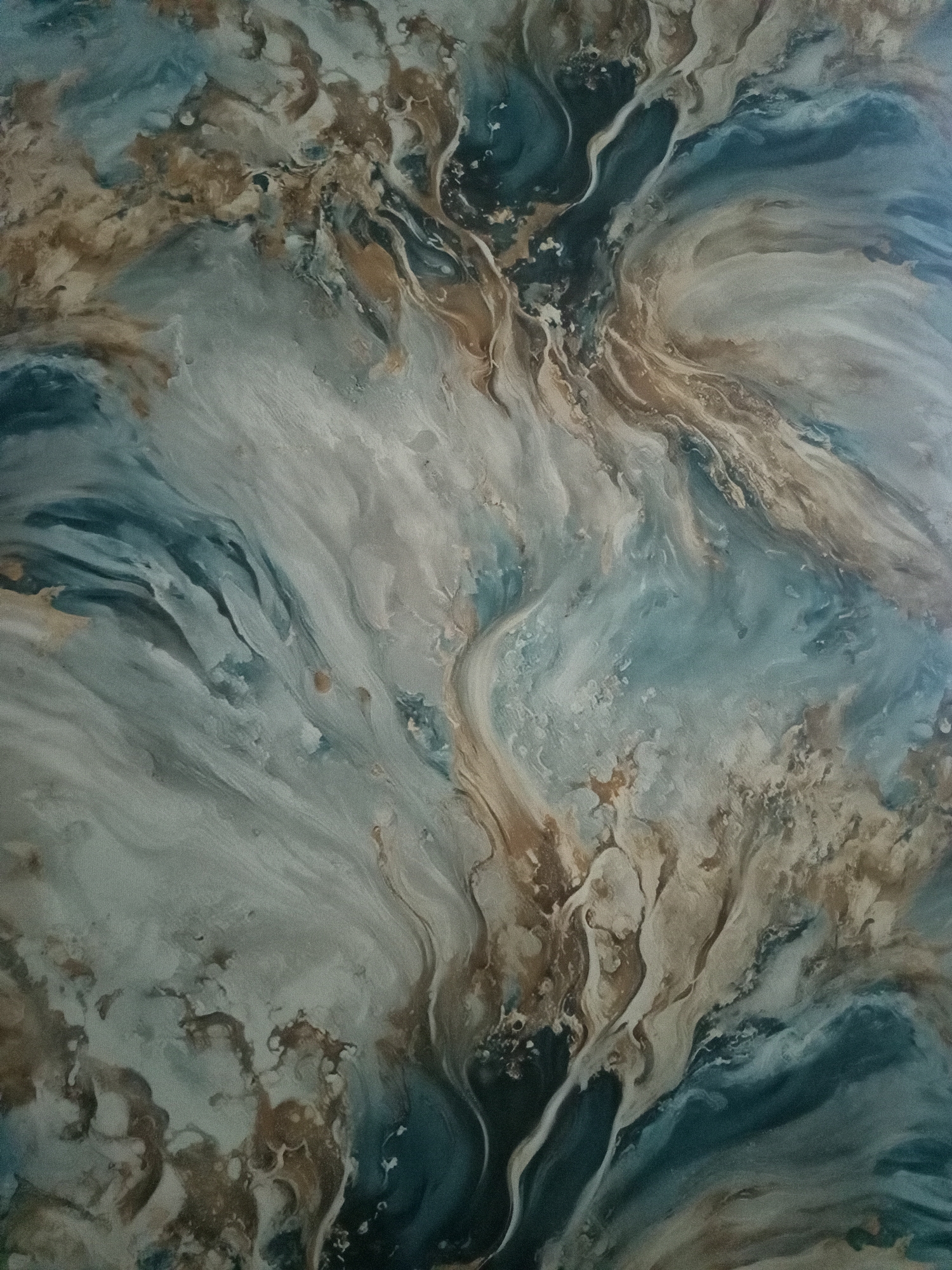 The image is an abstract painting with swirling patterns of blues, browns, and creams. The textures suggest a fluid, possibly marbled effect, with some areas appearing smooth and others more textured. The composition is dynamic, with lines and shapes flowing into each other, creating a sense of movement and depth. There are no discernible objects, people, or environmental features that would suggest a specific location in a city.