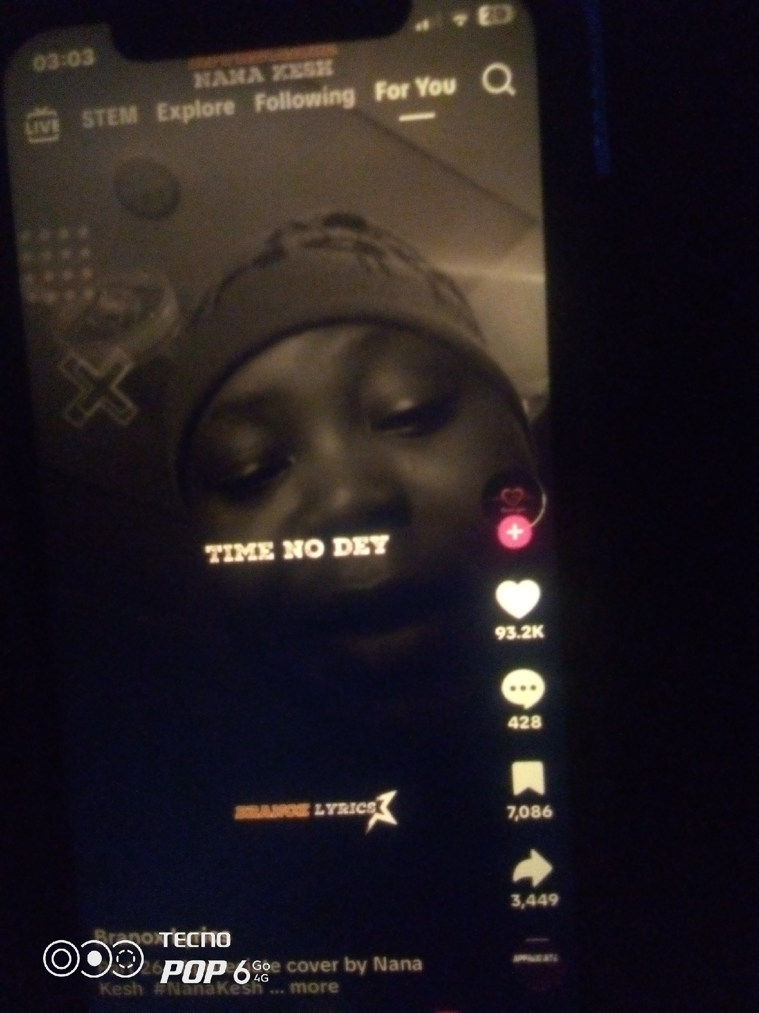 The image is a screenshot of a TikTok video. The video features a close-up of a person's face wearing a beanie hat. Text overlays on the video read "TIME NO DEY" and "BRANGE LYRICS". On the right side of the screen, there are icons for likes, comments, shares, and saves, with corresponding numbers. The bottom of the screen shows "Brano TECNO POP 6 Go 4G" and "Kesh #NanaKesh ... more". There is no information in the image that would indicate a specific location in Howayi, Nigeria.