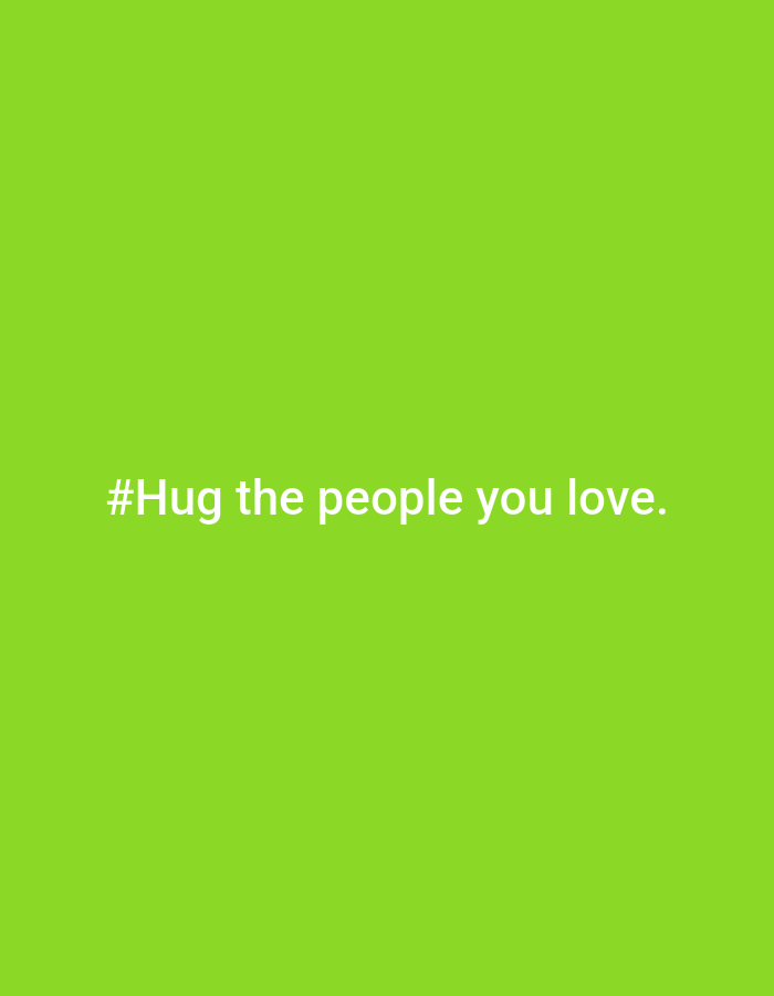 The image is a green background with the white text "#Hug the people you love." There is no visible location in the city of Chaikovsky, Russia, people, subjects, objects, actions, interactions, or environment depicted.