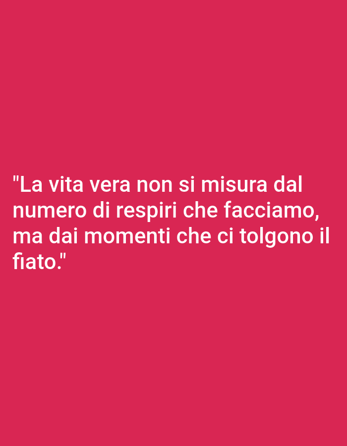 The image is a photograph with a solid pink background. White text is overlaid on the image, reading: "La vita vera non si misura dal numero di respiri che facciamo, ma dai momenti che ci tolgono il fiato." This translates from Italian to English as: "Real life is not measured by the number of breaths we take, but by the moments that take our breath away." There are no people, objects, or environmental details visible in the image other than the text and background. There is no information within the image that would allow for the determination of its location in Yessentukskaya, Russia.