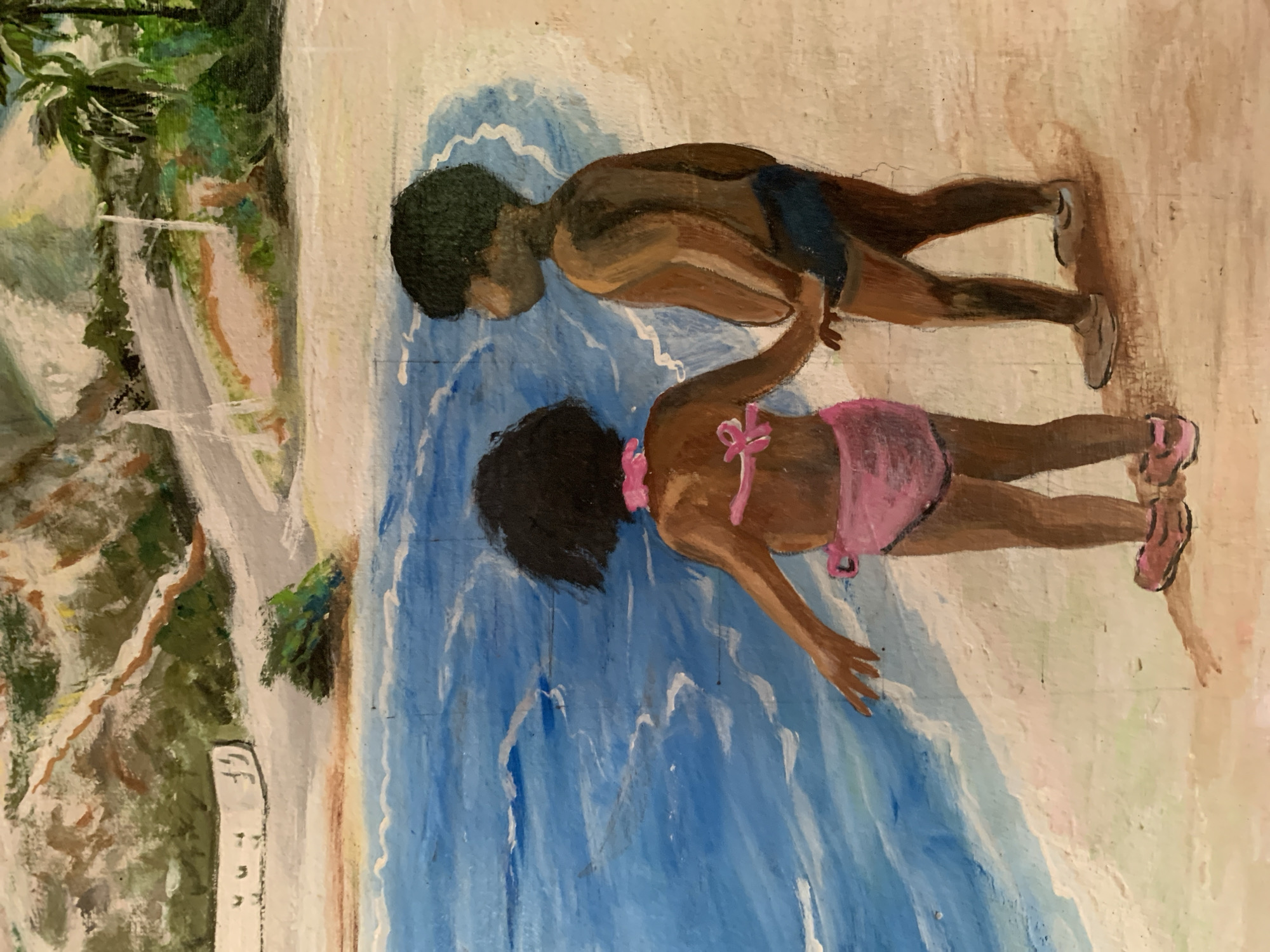 The image is a painting depicting a coastal scene in Santa Ana, Venezuela. In the foreground, two young children with dark skin and dark, curly hair stand on a light-colored sandy beach. The child on the left, a girl, wears a pink two-piece swimsuit with a bow on the top and pink shoes; her right arm is slightly extended towards the water. The child on the right, a boy, wears blue swim trunks and light-colored shoes; he holds the girl's left hand with his right hand. Both children are viewed from behind, looking out at the blue ocean where white waves are breaking. The background features light brown hills with green foliage, a winding grey road, and a white structure with dark markings on the left. Palm trees with dark green fronds are visible on the far right, suggesting a tropical environment.