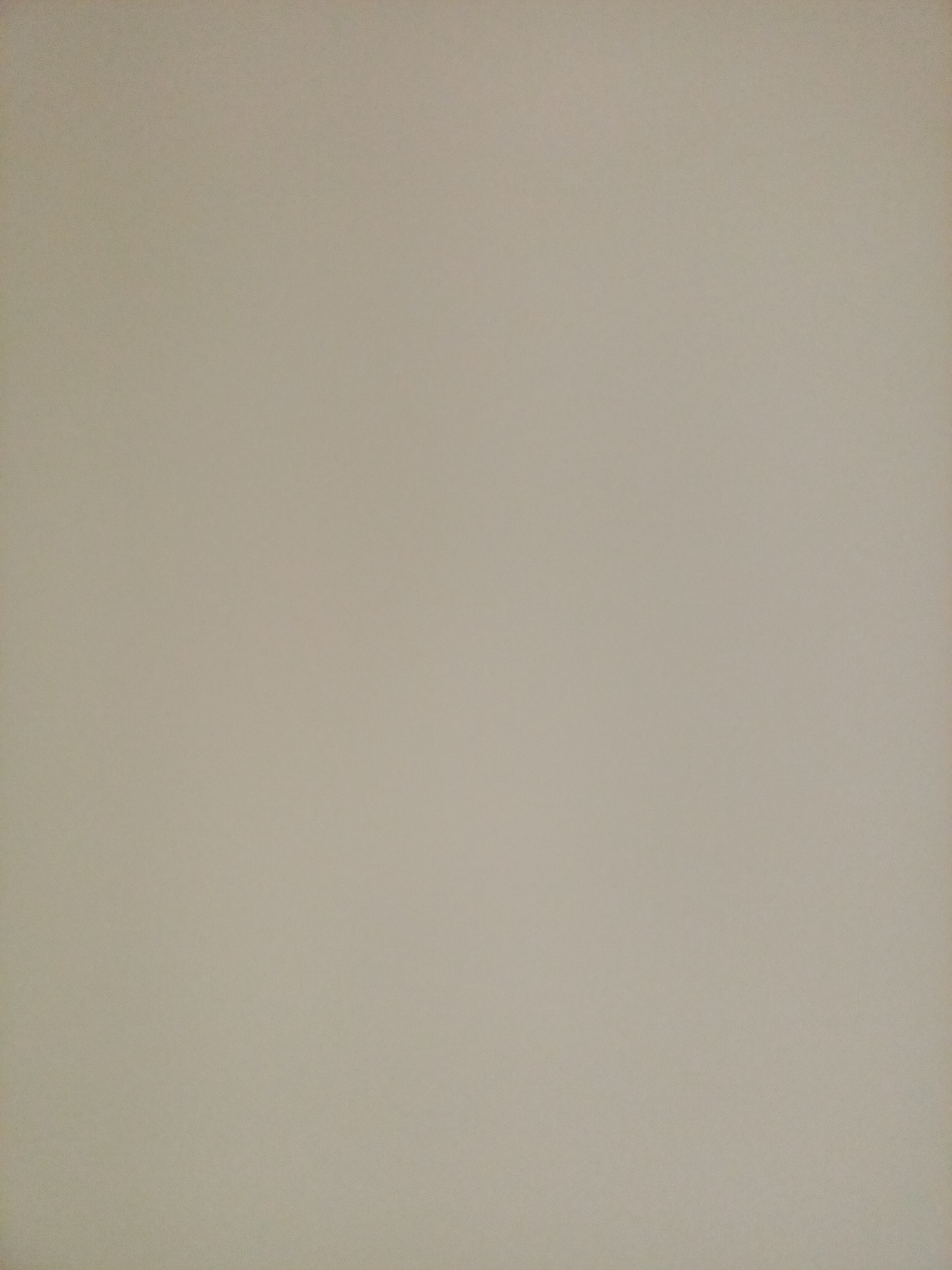 The image is a flat, evenly lit, plain beige background. There are no discernible objects, people, or actions. The image appears to be a scanned document or a photograph of a blank wall. It is not possible to determine the location within Rostov-on-Don, Russia.