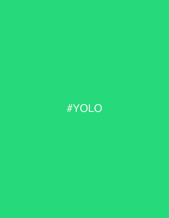 The image displays a solid, vibrant green background. Centered horizontally and vertically within this green field is the white text "#YOLO" in a sans-serif typeface. No other discernible subjects, objects, people, actions, interactions, or specific environmental features are present. The image does not contain any visual information to determine a location in Riga, Latvia, or any other city.