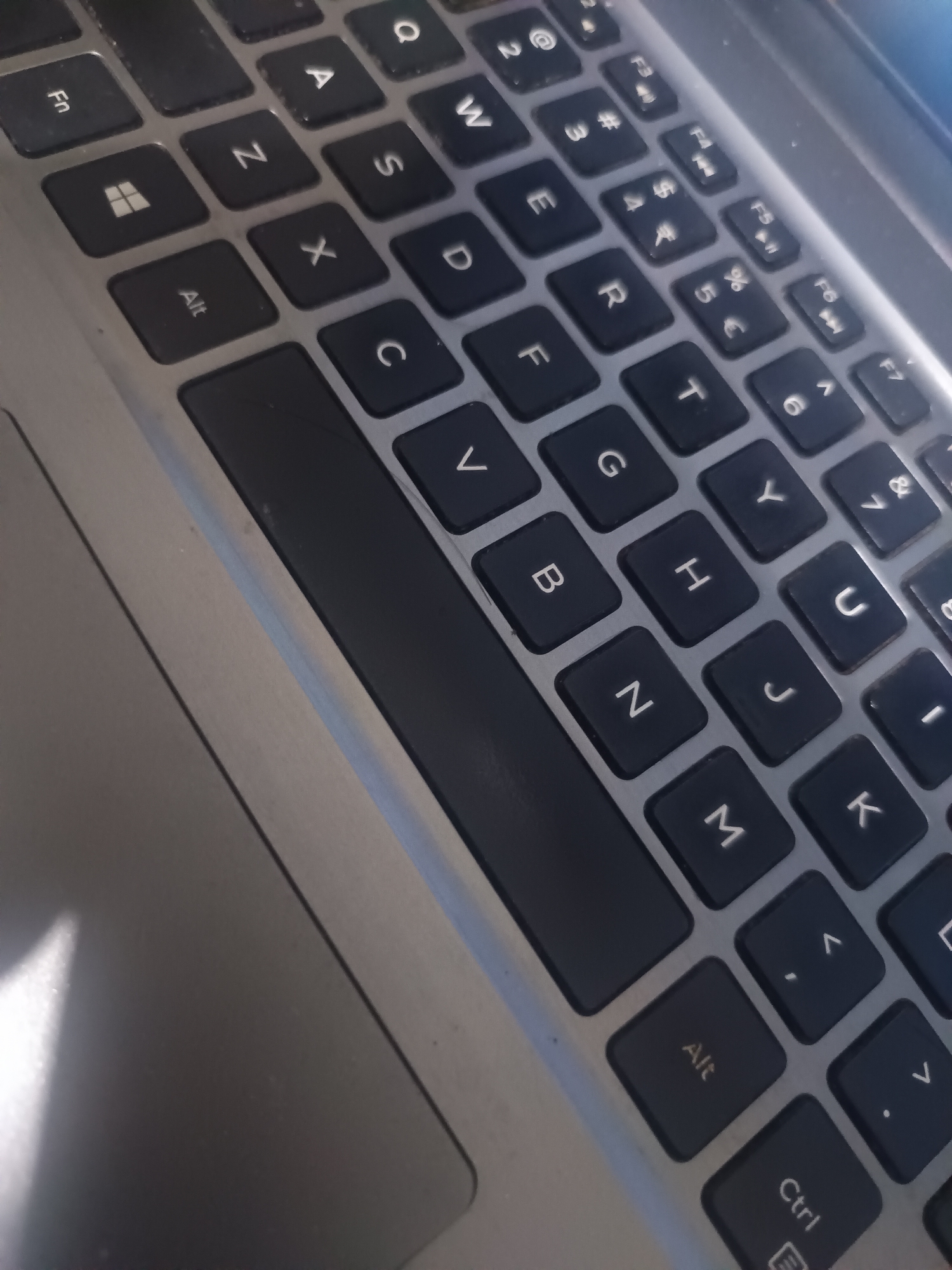 The image is a close-up of a laptop keyboard. The QWERTY layout is visible, with keys labeled "Fn", "Alt", "Ctrl", and the Windows logo. The alphanumeric keys are black with white lettering. The keys are organized in rows, with the space bar running horizontally across the middle of the image. The surrounding laptop casing is silver. The location in Maleber, Indonesia is not discernible from this image.