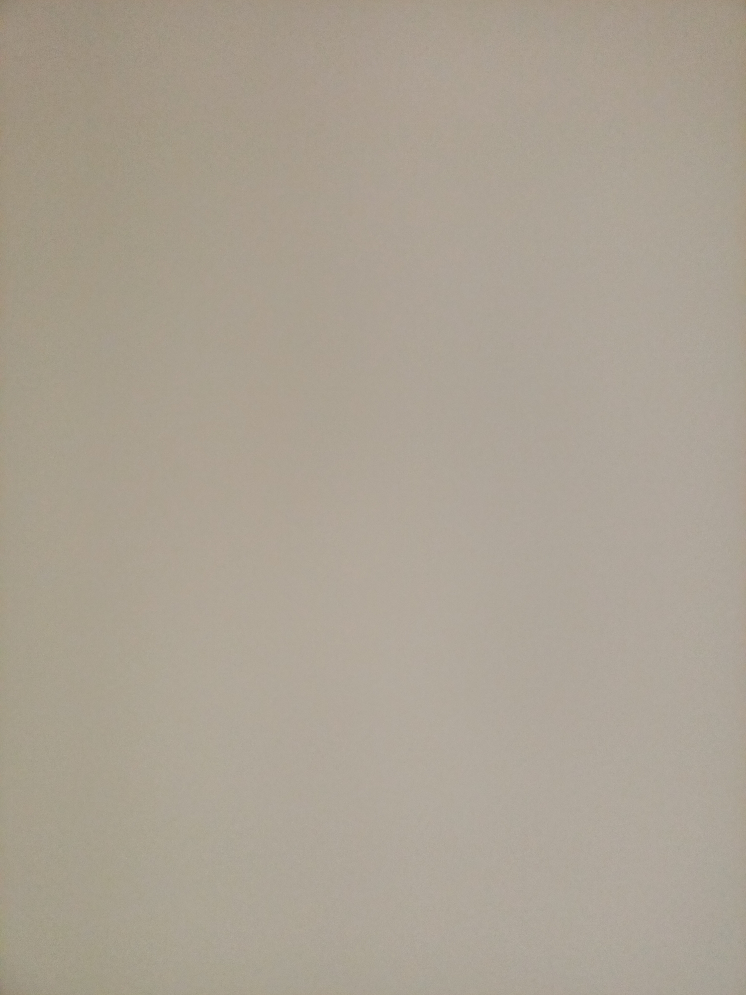 The image displays a uniformly beige, textured surface, likely a wall or fabric. There are no discernible objects, people, or environmental features present. The lighting appears even, with no strong shadows or highlights. The color is a muted, neutral tone. The image provides no contextual information about its location in Rostov-on-Don, Russia, or any other identifiable setting.