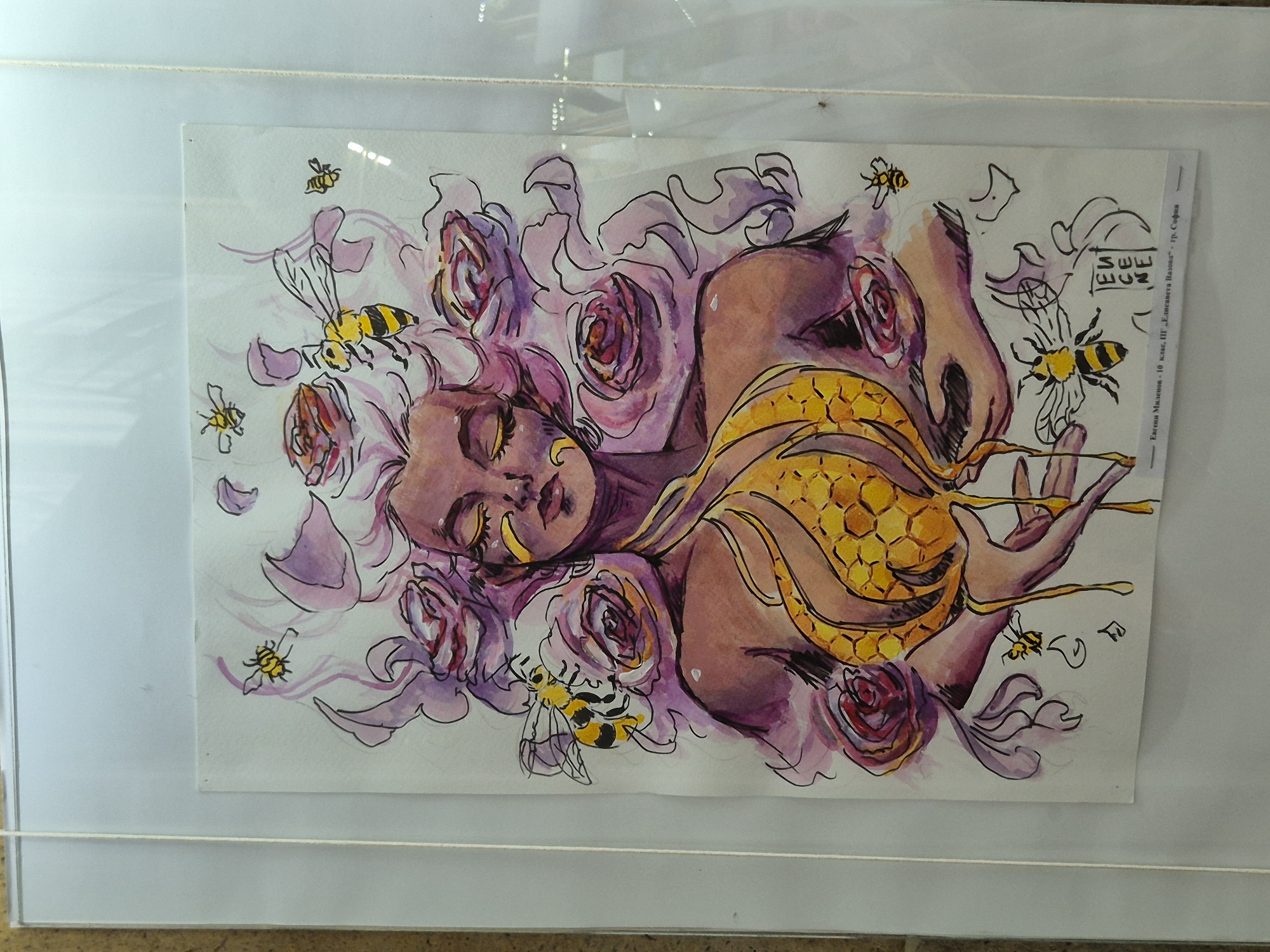 The image depicts a watercolor drawing of a woman with a honeycomb draped over her torso. Her head is surrounded by purple roses, and several cartoon-like bees are scattered around her. The drawing has a signature or logo on the top right and some text along the right edge, visible in the top right corner. The drawing is mounted in a frame, likely a display. The image does not provide any information regarding its location in Srebarna, Bulgaria.