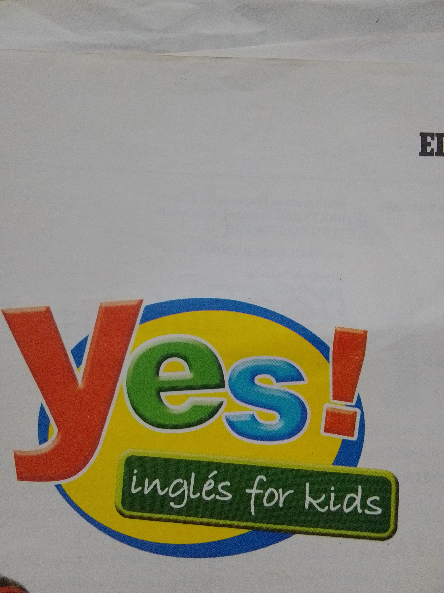 The image displays a logo with the word "Yes!" in large, colorful letters. The "Y" is orange, the "e" is green, and the "s!" is blue and orange. Below this, a green rectangular banner contains white text that reads "inglés for kids". The logo is superimposed on a white background, which appears to be a page from a book or publication. To the right of the logo, the letters "EL" are partially visible in black, suggesting a title or heading. The logo is positioned in the lower half of the image, with the "EL" text in the upper right quadrant. The scene is an indoor setting, likely a classroom or study environment, given the nature of the educational material. There are no people or any specific landmarks indicating a location within the city of La Tagua, Venezuela.