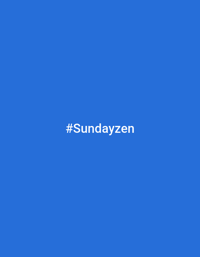 The image displays a solid, uniform royal blue background. Centered horizontally and vertically on this background is the white text "#Sundayzen" rendered in a sans-serif typeface. No other elements, figures, objects, or environmental features are present. The scene does not depict a specific physical location in the city of Unknown, Unknown, or any other identifiable geographic setting, as it appears to be a digital graphic. There are no individuals, actions, or interactions depicted.