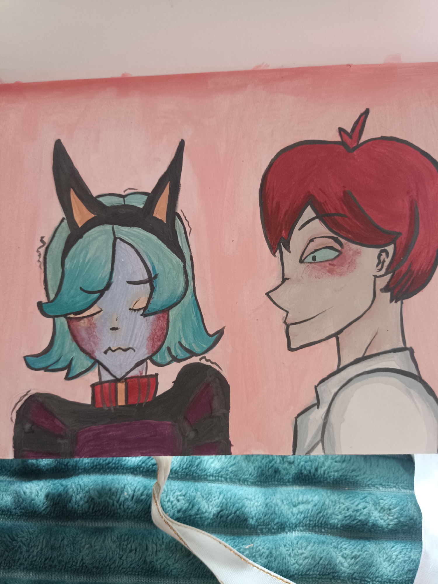 The image displays a close-up, portrait-style illustration of two anime-style characters against a light pink background. The character on the left has blue-green hair, cat-like ears, pale skin with red blush marks on the cheeks, and is wearing a dark outfit with a red and yellow striped collar. This character appears to be looking downwards with a distressed or uneasy expression. The character on the right has short, spiky red hair and pale skin with red blush marks under the eyes. This character is looking towards the left character with a sly smile, wearing a white collared shirt. The bottom portion of the image shows a textured, teal fabric. The image does not contain any elements that indicate a specific location within the city of Посад, Russia.