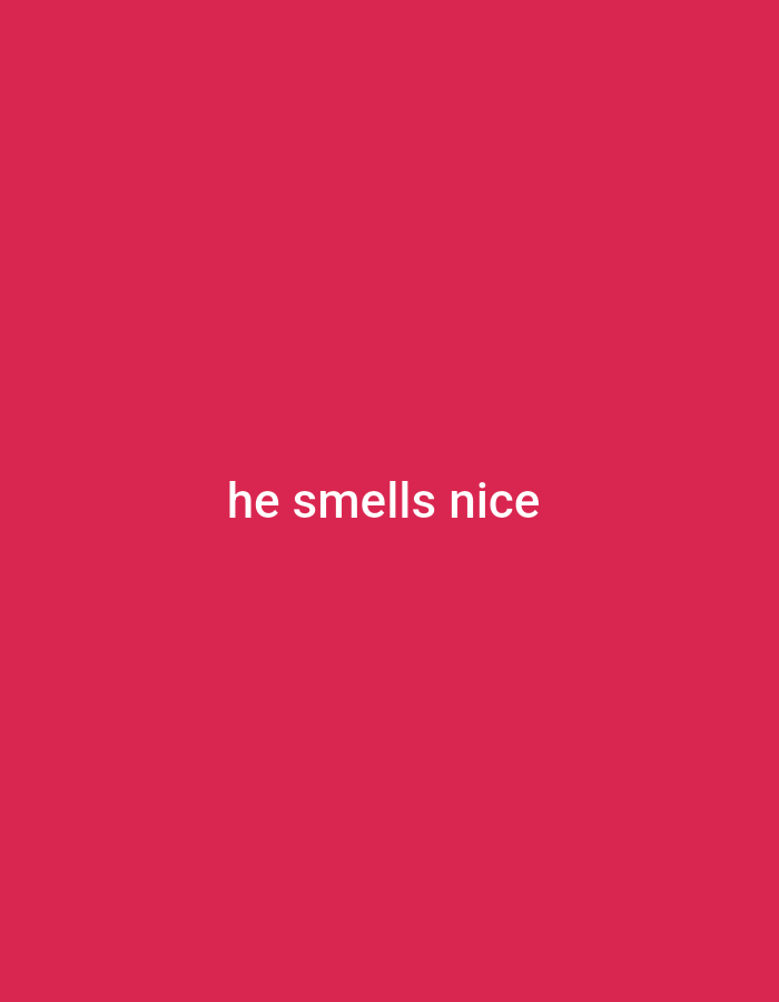 The image is a solid pink background with the white text "he smells nice" centered on it. The text is written in a sans-serif font. There is no discernible location in Gboko, Nigeria or any other city, as the image is purely digital text on a colored background. There are no people, subjects, objects, actions, or interactions depicted.