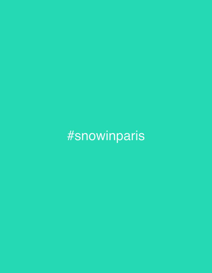 The image displays a solid, uniform teal-colored background. Centered horizontally on this background, in white sans-serif typeface, is the text "#snowinparis". No specific physical location, including any area within the city of Noisiel, France, is depicted in the image. There are no visible people, tangible subjects (other than the text), objects, actions, or interactions present. The environment is entirely a digital, uniformly colored canvas.