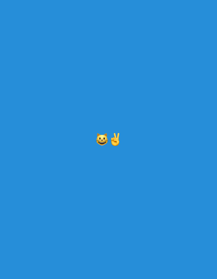 This is a digitally created image against a solid blue background. Centered in the frame are two emojis. On the left is a yellow cat face emoji with wide eyes and an open mouth showing teeth. To the right of the cat face is a yellow hand making a peace sign, with the index and middle fingers extended. There are no discernible features that would allow for the determination of a specific location in Gorzow, Poland.