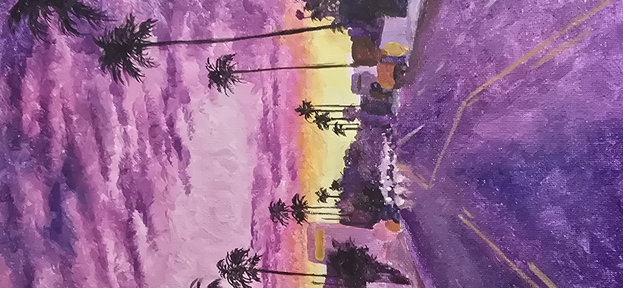 This is a painting of a sunset over a city street with palm trees. The sky is filled with dramatic purple and pink clouds, with streaks of yellow and orange near the horizon. The street is paved with purple asphalt and has yellow dividing lines. On either side of the street, there are buildings and lush green trees, with several tall palm trees silhouetted against the vibrant sky. In the distance, there are blurry lights suggesting moving vehicles. The overall mood is atmospheric and dreamlike, evoking a sense of a warm, exotic evening. The painting does not depict any identifiable landmarks or features specific to Gostagayevskaya, Russia.