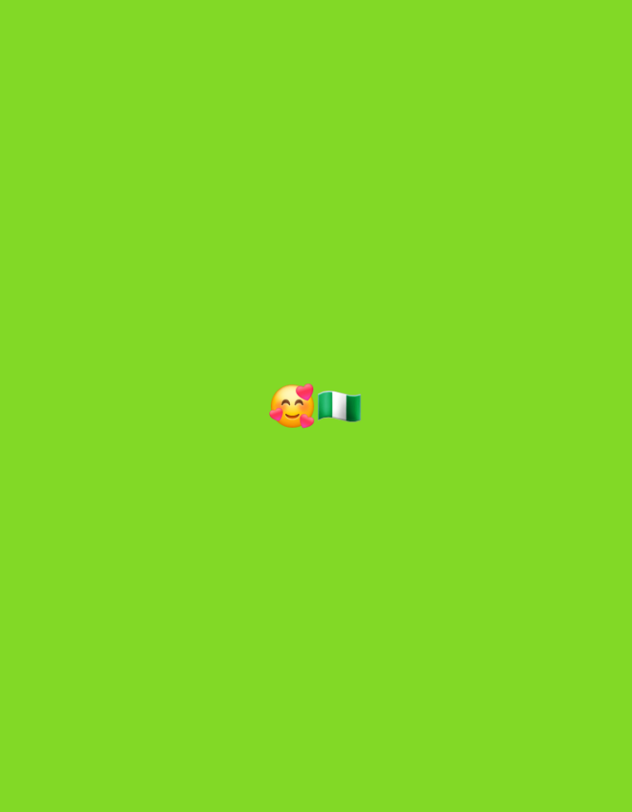 A digital image displays a bright green background with a small emoji of a face with hearts above it, and a Nigerian flag next to it. The emoji is smiling and blushing, with pink hearts encircling its cheeks and floating around its head. The Nigerian flag is depicted as a rectangular banner with three vertical stripes: green, white, and green. The emoji and flag are positioned in the center-right of the frame.