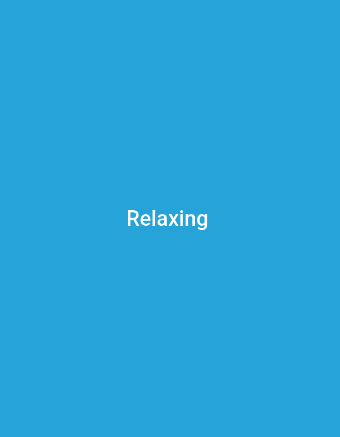 The image is a vertical, full-frame shot of a bright blue background with the white text "Relaxing" centered in the upper half. There are no people, objects, or discernible environmental features beyond the solid blue color. The location of Anilelerin, Nigeria, is not depicted or suggested in the image.