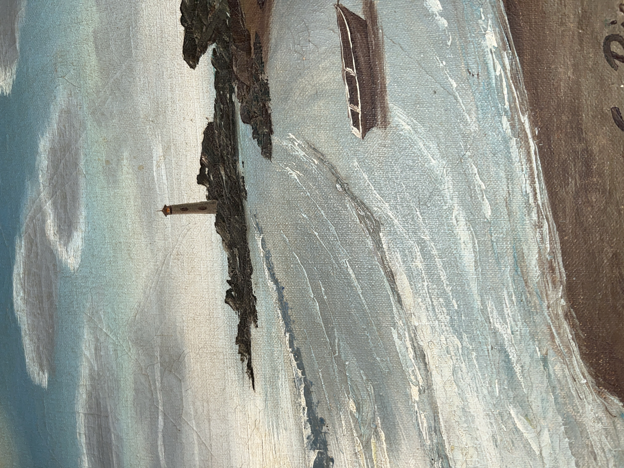 The image depicts a coastal scene, likely a painting. A rocky cliff face dominates the composition, with a small, brown lighthouse situated near its base. A solitary boat with a visible window floats on the water next to the cliff. The water is rendered in shades of blue and white, with visible brushstrokes suggesting movement. The sky is a pale blue, fading into white near the horizon. The painting style appears aged, with visible cracking in the paint. Part of the artist's signature "D" is visible. The location is not apparent in the image alone; this would require external context.