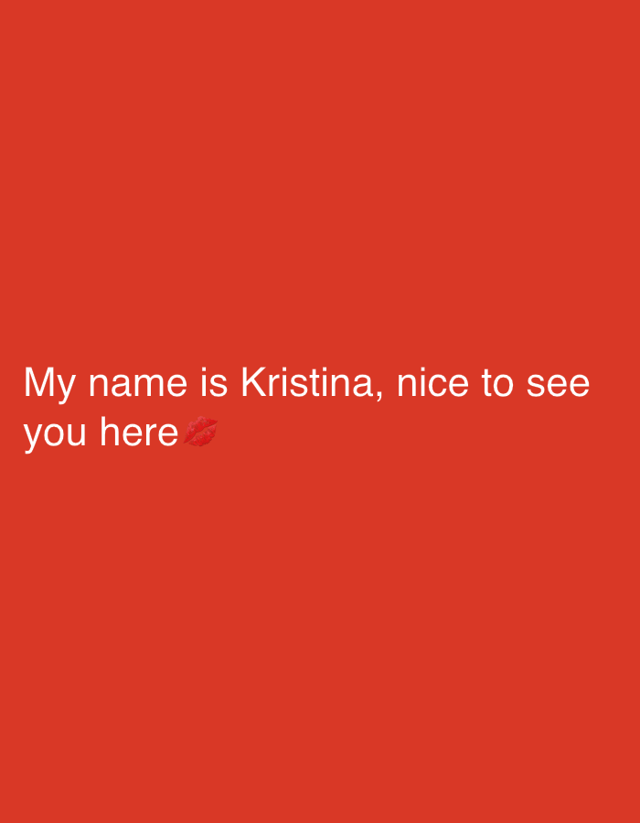 The image features white text on a solid, vibrant red background. The text reads: "My name is Kristina, nice to see you here". Following the word "here", a red lipstick kiss mark emoji is displayed. There are no other discernible subjects, objects, or a specific scene, and no activity is depicted beyond the presentation of this text-based message. The uniform background suggests a digital graphic or a screenshot from a messaging application. The message conveys a friendly and welcoming tone.