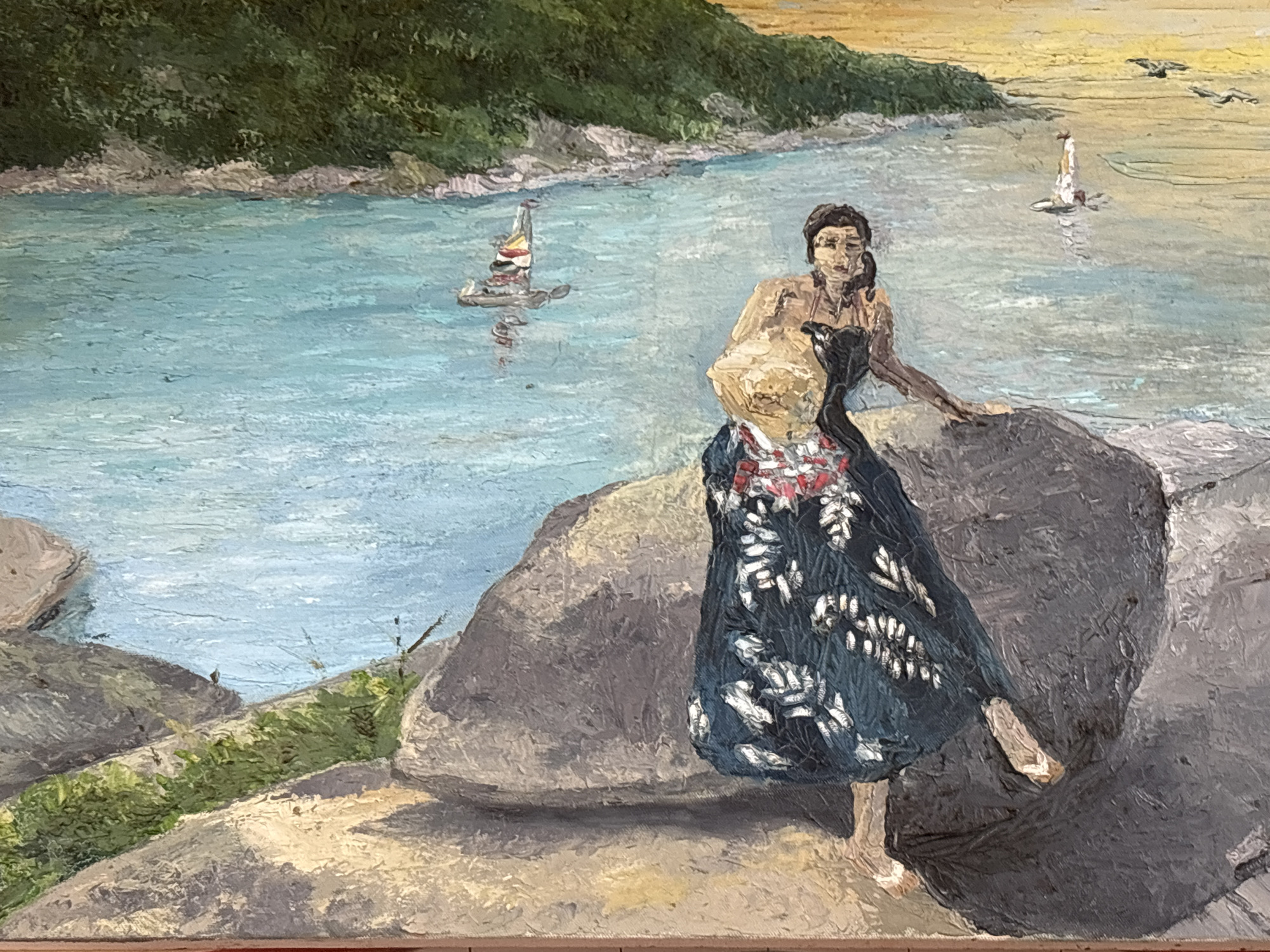 The painting depicts a coastal scene with a body of water, a shoreline with vegetation and rocks, and a yellow sky. In the foreground, a person is seated on a large rock, wearing a dark dress with a white floral pattern and what appears to be a lighter colored garment underneath. Another person, or the same person from the waist up, is visible slightly behind and to the left, wearing a lighter colored top and looking towards the water. There are two sailboats visible in the water, one closer and one further in the distance. The landscape suggests a tropical environment, possibly a beach or bay. The painting style is impressionistic, with visible brushstrokes. There are no discernible landmarks or elements that specifically place this scene in Chalong, Thailand.