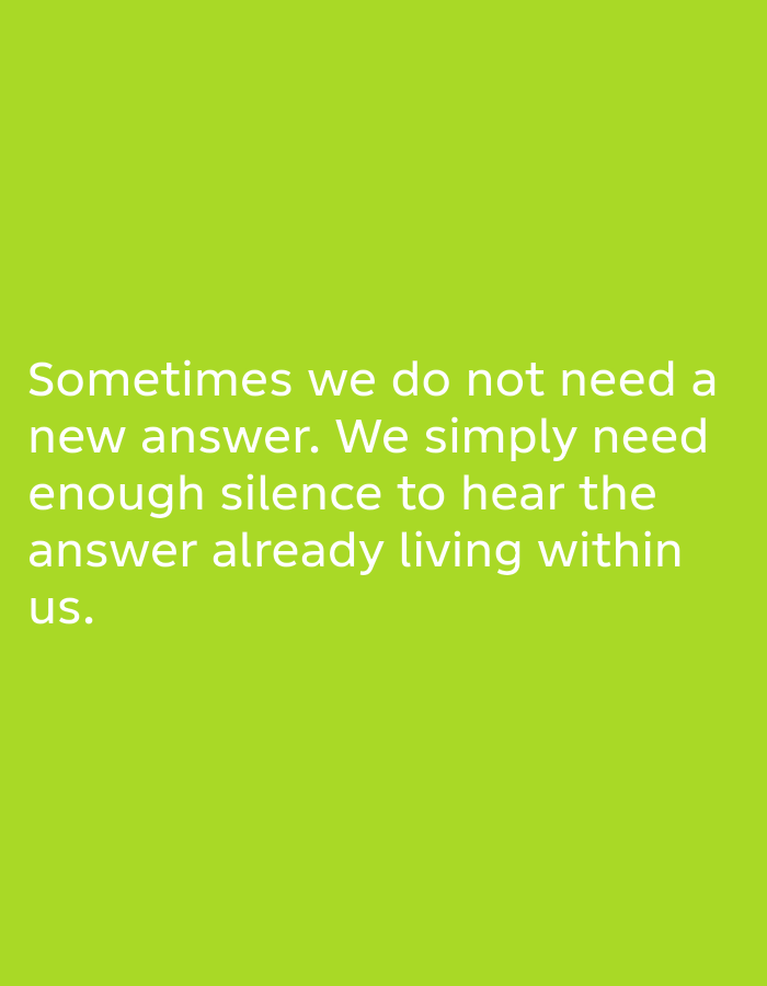 The image is a photograph of text on a bright green background. The text, in white sans-serif font, reads: "Sometimes we do not need a new answer. We simply need enough silence to hear the answer already living within us." There are no people, objects, or any discernible environmental features beyond the plain green background. There is no indication of the image's location in Muaro Jambi, Indonesia.