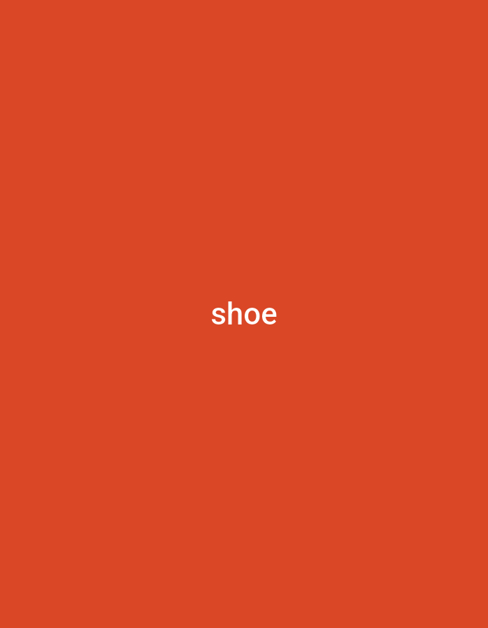 This image is a plain orange background with the word "shoe" written in white text in the center. There is no discernible scene, setting, or activity. The text is the only notable detail. The color of the background is a vibrant, almost fiery orange. The text is clear and easy to read, with a simple sans-serif font. There are no other visual elements to suggest a specific time of day, weather, location, or emotion. The context provided, Numan, Nigeria, does not offer any visual cues that are present in the image itself.