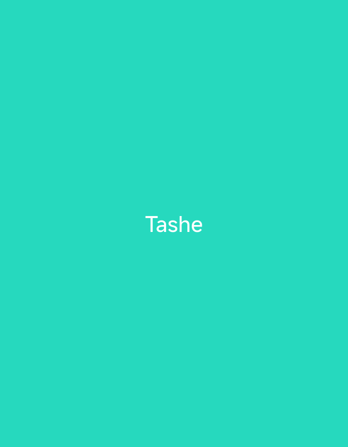 The image is a plain teal background with the word "Tashe" written in white text in the center. There is no information available about the location in the city of Jauro Shomwa, Nigeria.