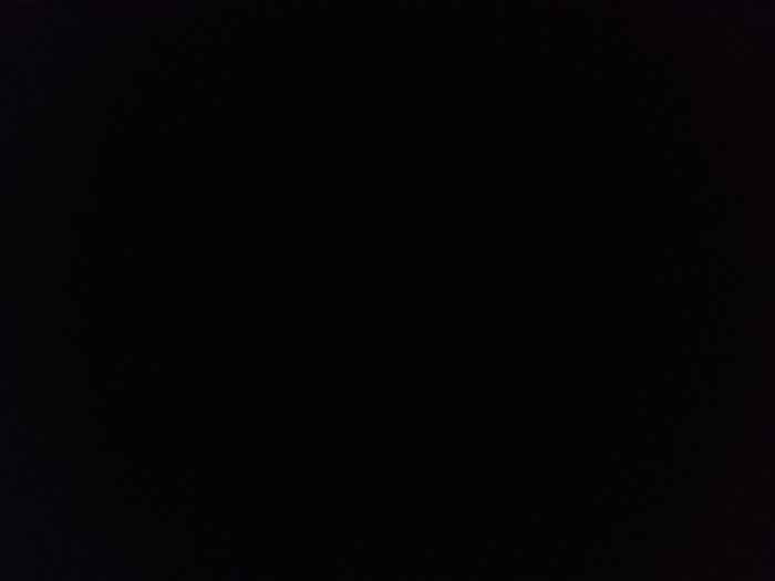 The image is entirely black, suggesting a dark or unlit environment. There are no discernible objects, shapes, or textures visible. The lack of contrast or detail implies a complete absence of light or a deliberate obscuring of any visual elements.