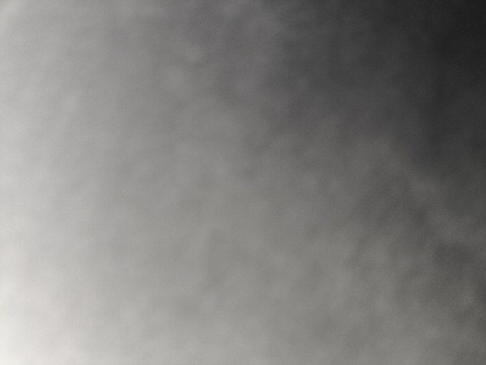 The image shows a blurry, gray sky. The coordinates -8.074, 111.932 place the image in Tulungagung, Indonesia. There are no people, objects, or actions visible in the image. The sky appears overcast with a slight gradient from dark to light gray.