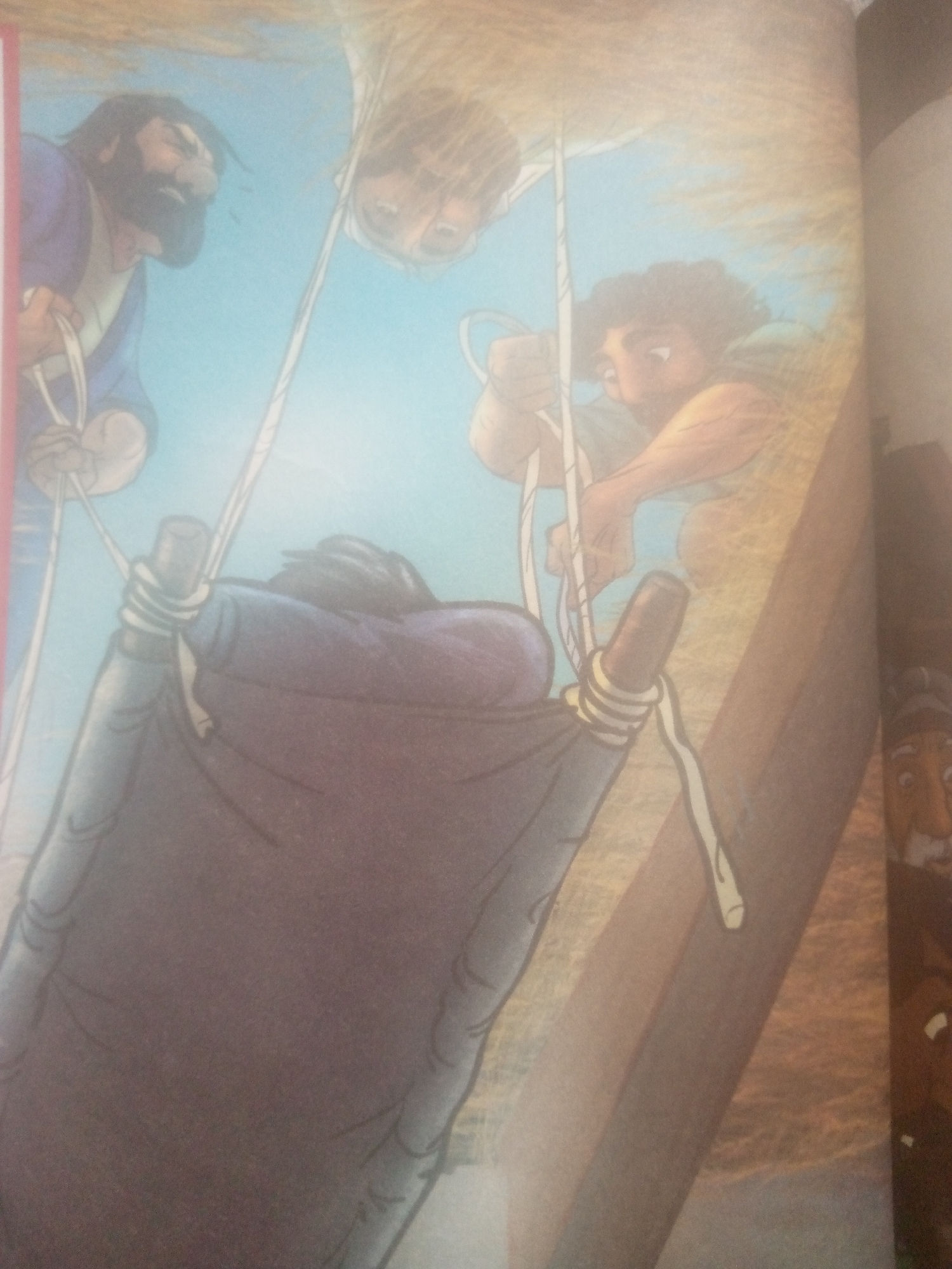 The image shows a scene from a book illustration with a sky blue background, suggesting an outdoor setting. Three men are depicted. One man with a beard and dark hair, wearing a purple garment, is on the left. He is holding a rope in his right hand. In the center, a man with light brown hair is shown from the neck up, looking downwards. To the right, another man with dark curly hair and a tan complexion is also looking down and holding onto a rope. In the foreground, a dark purple hammock-like object is suspended by ropes, held by the men. A wooden structure is visible on the right side of the image. The overall scene appears to be one of an effort to lower or raise the hammock. There is no indication of the city of Jalingo, Nigeria, or any specific geographical location.
