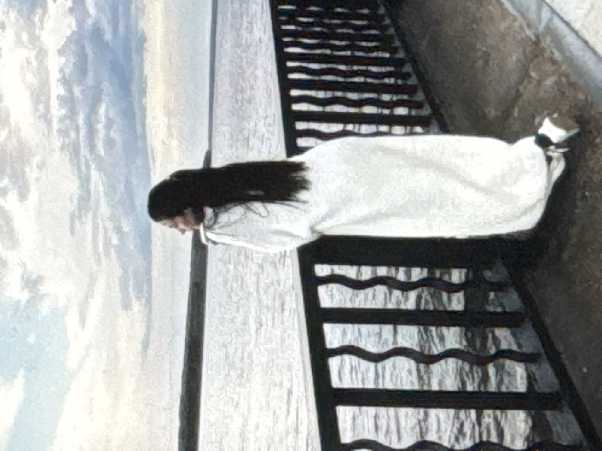 The image depicts a woman in a white dress lying on metal stairs next to a body of water. The woman has long, dark hair. The stairs appear to be part of a pier or embankment. The body of water seems to be a river or lake, and the background shows a cloudy sky and distant shoreline. The location appears to be in Chaikovsky, Russia, based on the water in the background.
