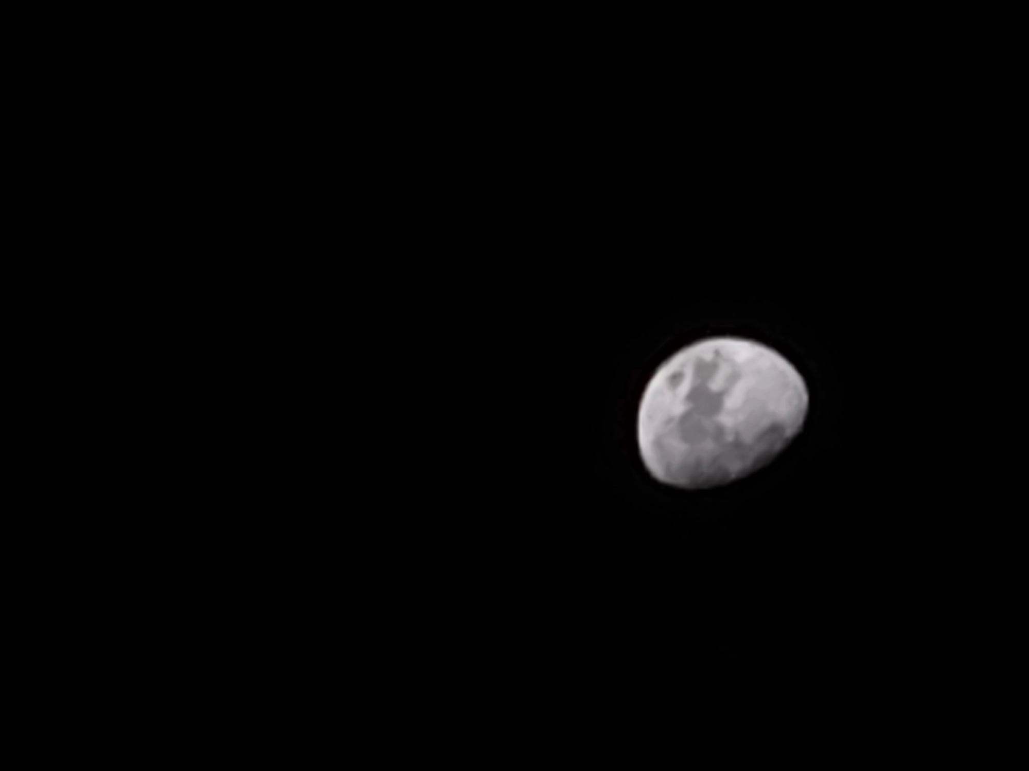 The image depicts a waxing gibbous moon against a black background. There are no indications of the location being Пловдив, Bulgaria, or any other city.