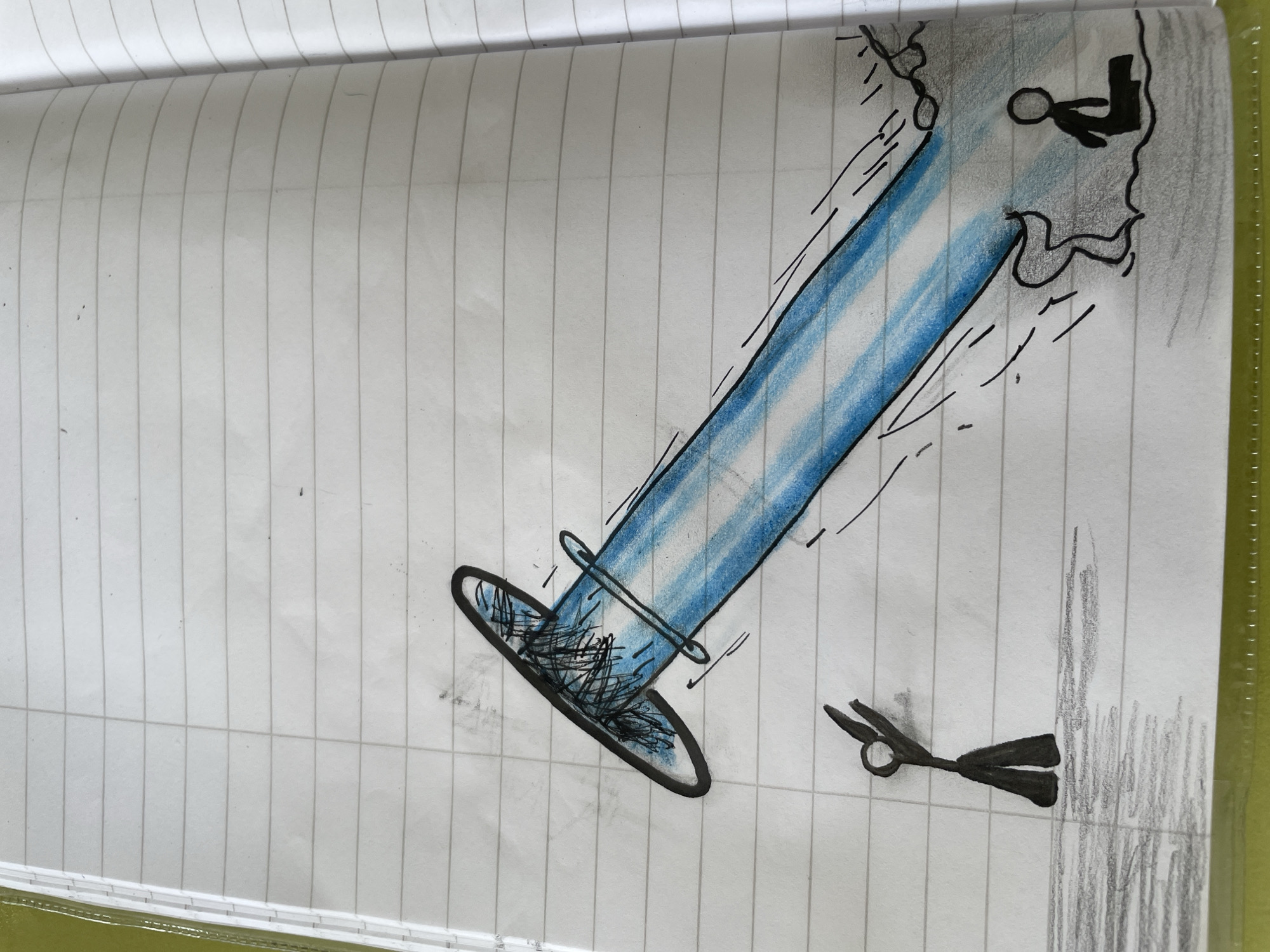 The image is a hand-drawn sketch on lined paper. A blue beam or tube extends diagonally across the page, apparently originating from a rough, gray drawing of a figure within a darkened area in the upper right corner. The beam ends in an elliptical shape closer to the bottom left, with dark scribbles inside, suggesting energy or matter. A pair of small, black scissors lie near the lower right of the page. The setting or location in the city of Zlatograd, Bulgaria is not indicated by the provided image or details.