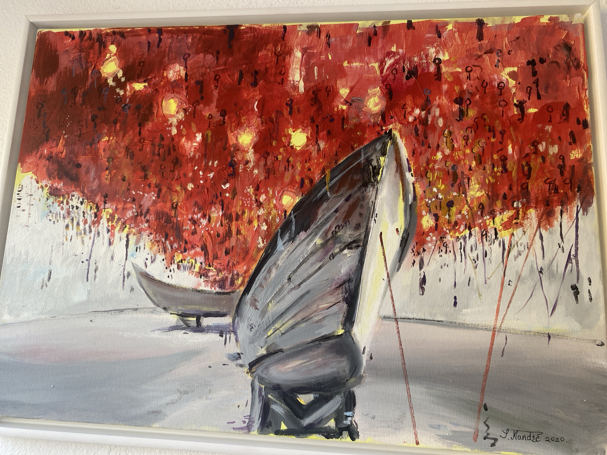 This is a painting of a scene that evokes a vibrant, possibly festive atmosphere. The upper portion of the canvas is dominated by a dense explosion of red and yellow, suggesting a canopy of glowing lights or foliage. Hints of darker colors and smaller shapes within this red mass could represent figures or objects. In the foreground, two boats are depicted. The larger boat, in shades of gray and black, is angled towards the viewer, its hull suggesting a sleek, modern design. A smaller, lighter-colored boat is positioned further back and to the left, its shape more traditional and elongated. The surface the boats rest on is a muted gray, with subtle reflections and shadows, hinting at water or a flat, polished surface. The painting is signed in the lower right corner with "J. Mandre 2020." While the painting itself does not explicitly depict Sutomore, Montenegro, the style and subject matter could be interpreted as an artistic representation of a lively evening or celebration that might occur in a coastal town like Sutomore, known for its vibrant summer atmosphere and boat-lined shores.