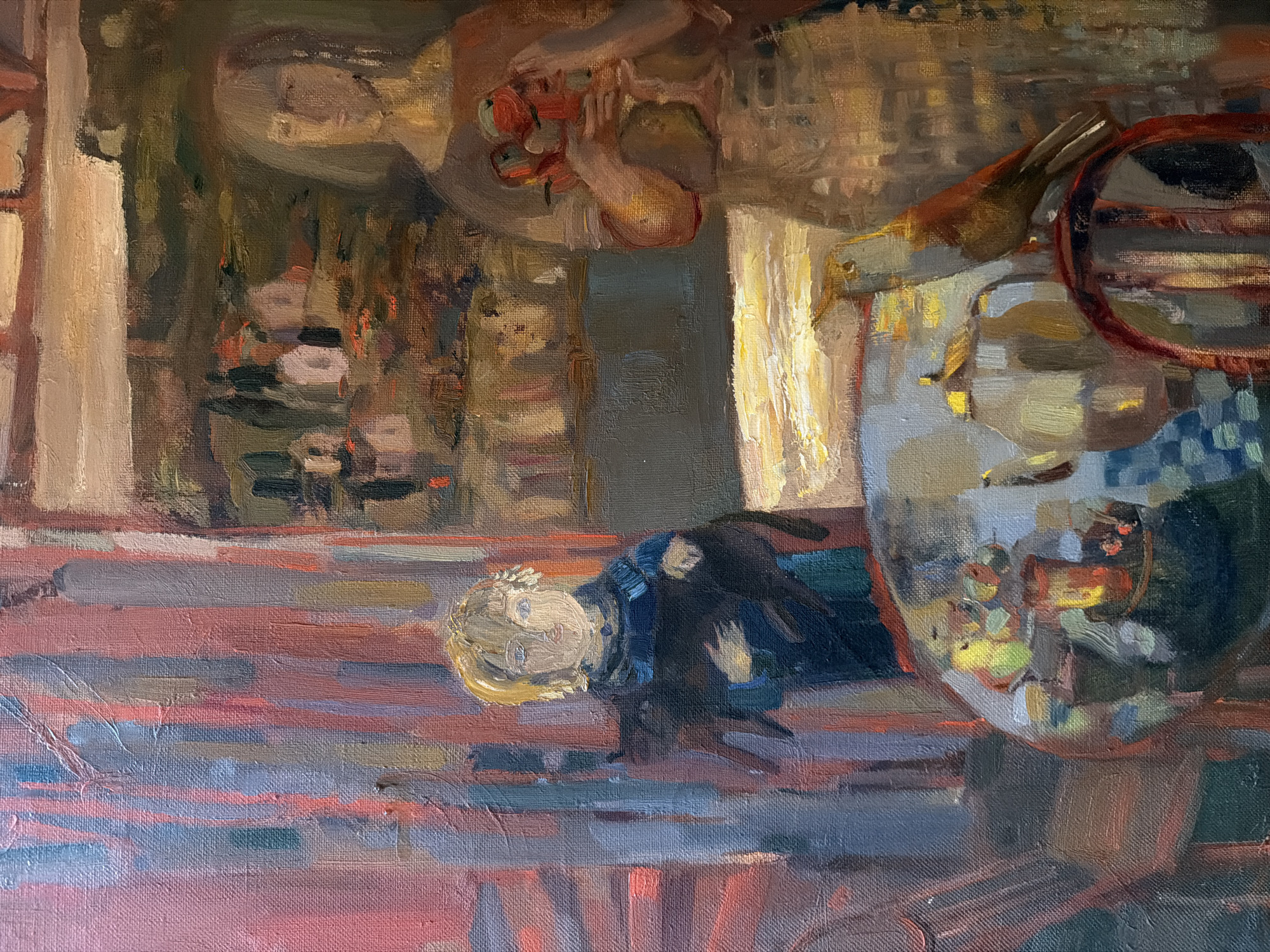 The image is an oil painting depicting an interior scene, likely a domestic setting. The painting features a young child lying on what appears to be a rug with a dark object, possibly a toy or pet, beside them. A table with various objects, including what seems to be a bowl of fruit and a teapot, is visible. The background features elements that could be interpreted as a wall with paintings or decorations. The painting has an impressionistic style, with loose brushstrokes and muted colors. There is no indication of a location in the city of Levkovo, Russia in the image.