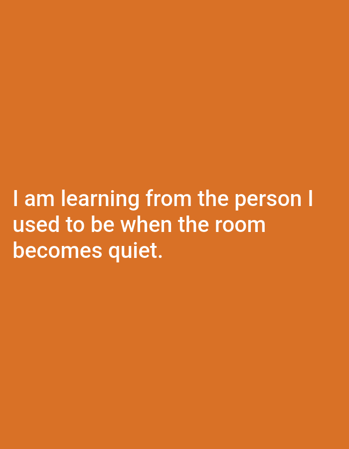 The image contains white text on an orange background. The text reads "I am learning from the person I used to be when the room becomes quiet." There is no discernible location in Genteng, Indonesia, or any people, subjects, objects, or actions depicted.