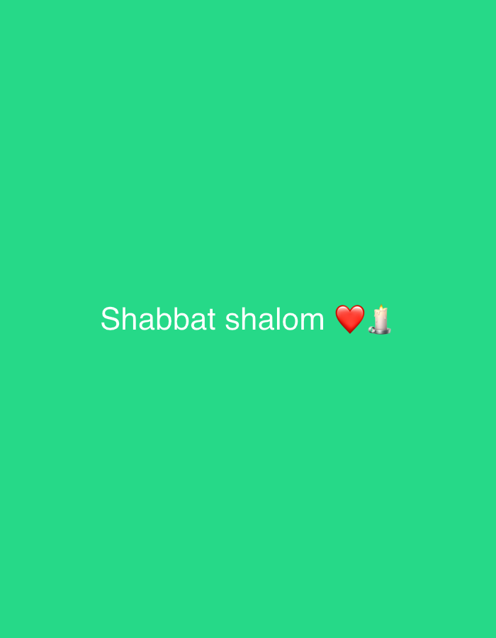 A digital image shows a green background with the white text "Shabbat shalom" in the center of the frame, followed by a red heart emoji and a candle emoji. There is no depiction of Tel Aviv, Israel, or any specific location. No people or actions are shown.