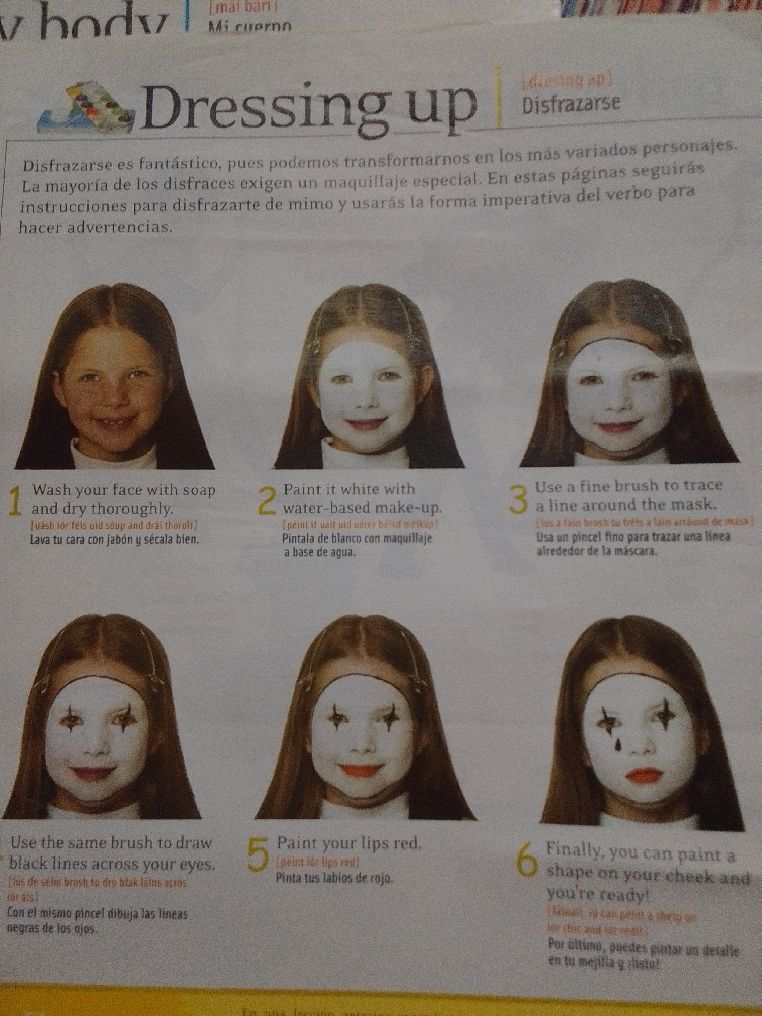 This image is a page from a magazine or book, featuring instructions for face painting. The page is titled "Dressing up" with the Spanish translation "Disfrázarse." There are six numbered steps, each with an accompanying photograph of a child's face undergoing the transformation. The children are depicted with their faces partially or fully painted. The text includes English instructions, phonetic spellings, and Spanish translations. The environment appears to be an indoor setting with printed text and photographs. There is no indication of the city of La Tagua, Venezuela, or any specific geographical location within the image.