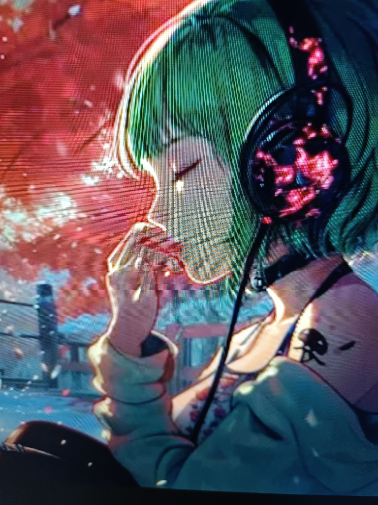 An animated depiction shows a young person with green hair wearing large headphones. Their eyes are closed, and one hand is raised to their face, touching their chin. The background features a blurred scene of red trees with falling leaves, suggesting an autumn setting. A structure resembling a fence or railing is visible in the mid-ground. The overall aesthetic is illustrative and digital in nature. There are no identifiable elements that would suggest a specific location within the city of Taraz city administration, Kazakhstan.