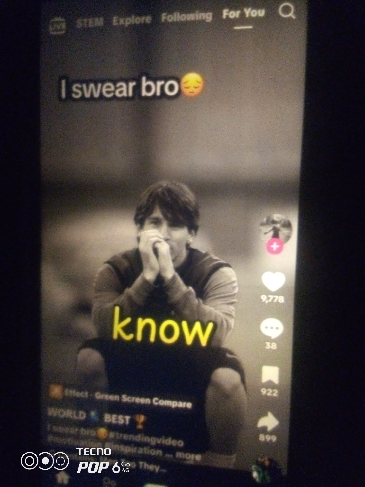 The image shows a close-up of a smartphone screen displaying a TikTok video. The video features a black and white shot of a man, likely Lionel Messi, with his hands clasped in front of his face. Text overlays on the video read "I swear bro" and "know". The interface elements of the TikTok app are visible, including a profile icon with a plus sign, a heart icon with a count of 9,778, a comment icon with a count of 38, a bookmark icon with a count of 922, and a share icon with a count of 899. Hashtags like "#trendingvideo" and "#inspiration" are also present. The bottom of the screen displays "TECNO POP 6 GO 4G" and a logo, indicating the phone model. The context of Howayi, Nigeria, is not discernible from the image itself.