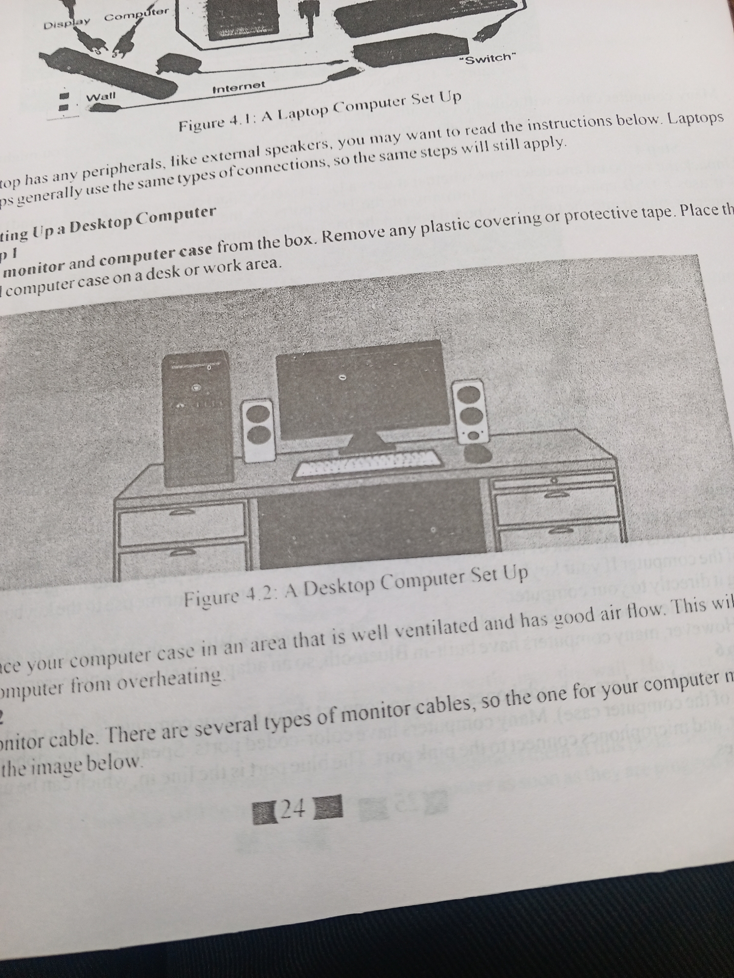 This media file contains a close-up, overhead view of an open textbook page. The page displays an illustration and accompanying text related to computer setup.
The top of the page shows a diagram labeled "Figure 4.1: A Laptop Computer Set Up," illustrating various components and connections of a laptop setup, including a display, computer, wall outlet, and internet connection. Below this, text discusses laptop peripherals and connections.
The central portion of the page features another illustration labeled "Figure 4.2: A Desktop Computer Set Up." This diagram depicts a desktop computer tower, monitor, keyboard, and speakers placed on a desk with drawers. Accompanying text provides instructions for setting up a desktop computer, emphasizing proper placement for ventilation.
The bottom of the page contains further text relating to monitor cables and computer overheating. A page number indicator, "24," is visible in the lower right corner. The overall scene is that of an educational document, likely a textbook or manual, with a focus on computer hardware and its assembly. There are no people or explicit time/weather/location cues visible in the image itself. The image is grayscale.