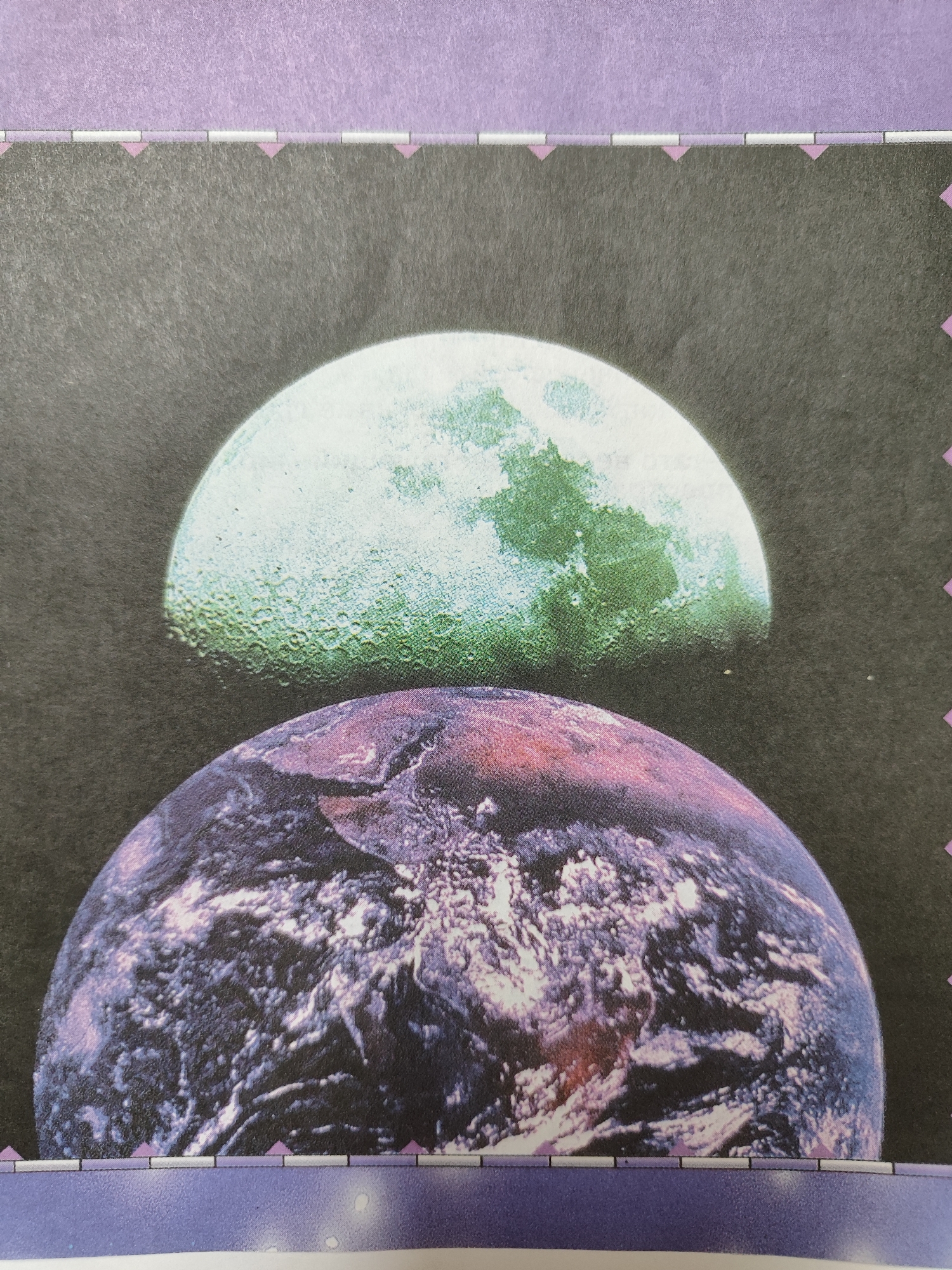 The image is a close-up, top-down view of a collage featuring two celestial bodies against a dark, speckled background. The upper celestial body is a representation of the moon, depicted with textured craters and shades of light green and white. Below it, the lower celestial body is a representation of Earth, showing swirling clouds and landmasses in shades of purple, pink, and white. A decorative border with a textured purple band and a repeating pattern of white and pink geometric shapes runs along the top and bottom of the image. There is no visible indication of Rasskazovo, Russia, in this image.