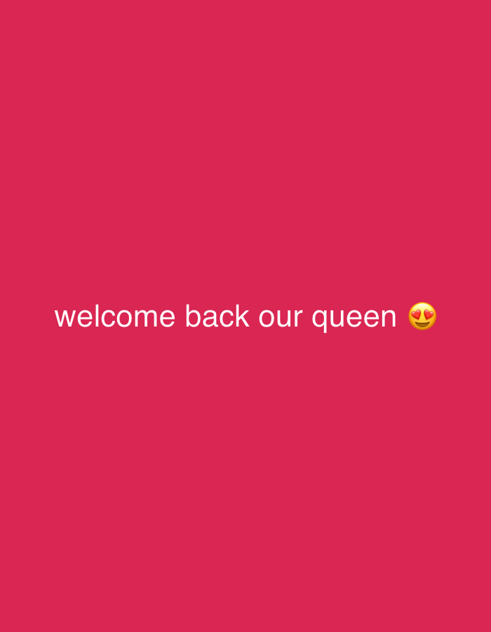 The image displays white text and an emoji centered on a solid crimson-red background. The text reads "welcome back our queen" followed by a yellow face with heart-shaped eyes emoji (😍), conveying strong affection or admiration. There are no other subjects, objects, or discernible details about a specific scene, location, or time of day.
