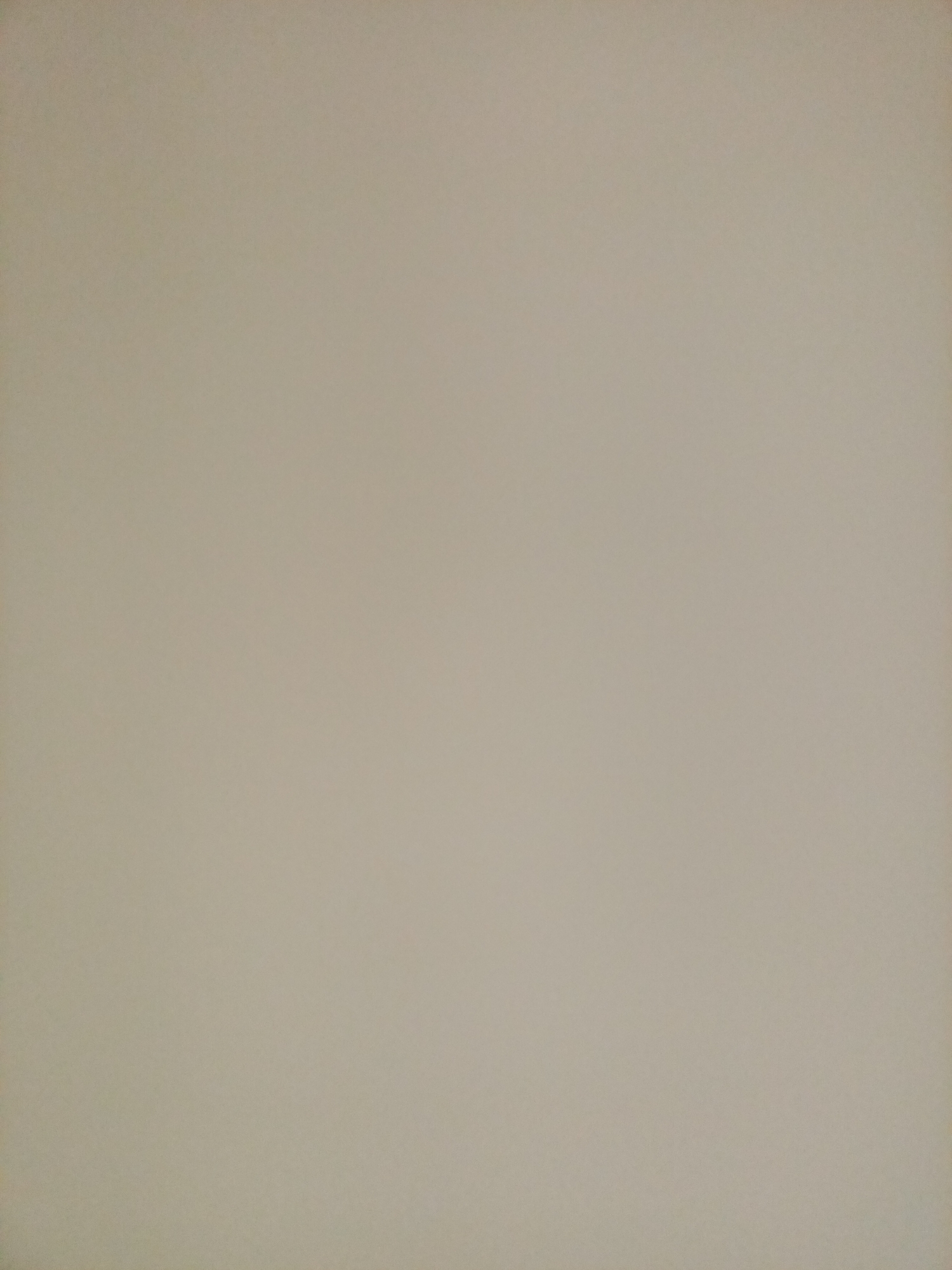 The image depicts a plain, light brown textured background, resembling a wall or paper. There are no discernible objects, people, or actions present in the image. The environment is sterile and featureless. No specific location in Rostov-on-Don, Russia, can be identified from this image.