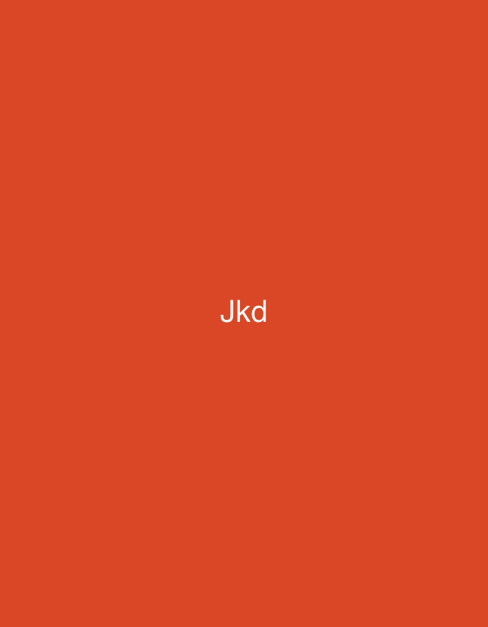 In the city of Casablanca, Morocco, the image displays a solid, uniform orange-red background. Centered on this background, in white, lowercase, sans-serif font, is the text 'Jkd'. The visual frame contains no discernible people, additional subjects, objects, actions, interactions, or specific environmental features.