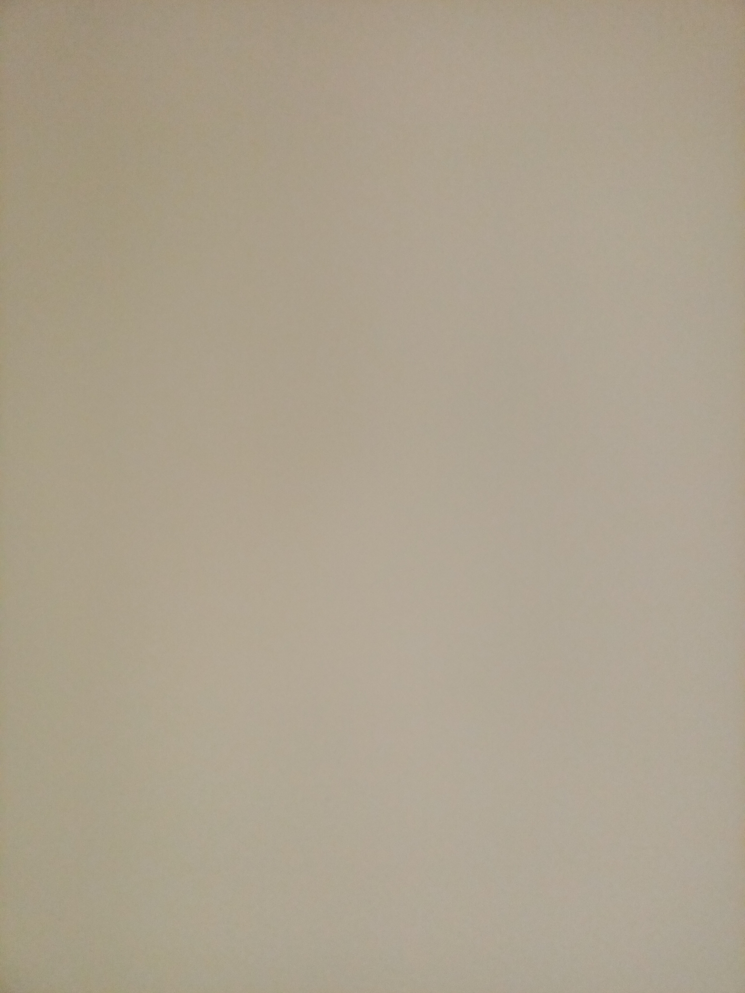 The image is a plain, uniformly colored background with no discernible subjects, objects, or environmental details. It appears to be a photographic representation of a blank surface, likely a wall or paper, with a neutral beige or off-white hue. There is no indication of any specific location within the city of Rostov-on-Don, Russia, or any other geographical context. The lighting is even and casts no shadows, suggesting a diffused light source.