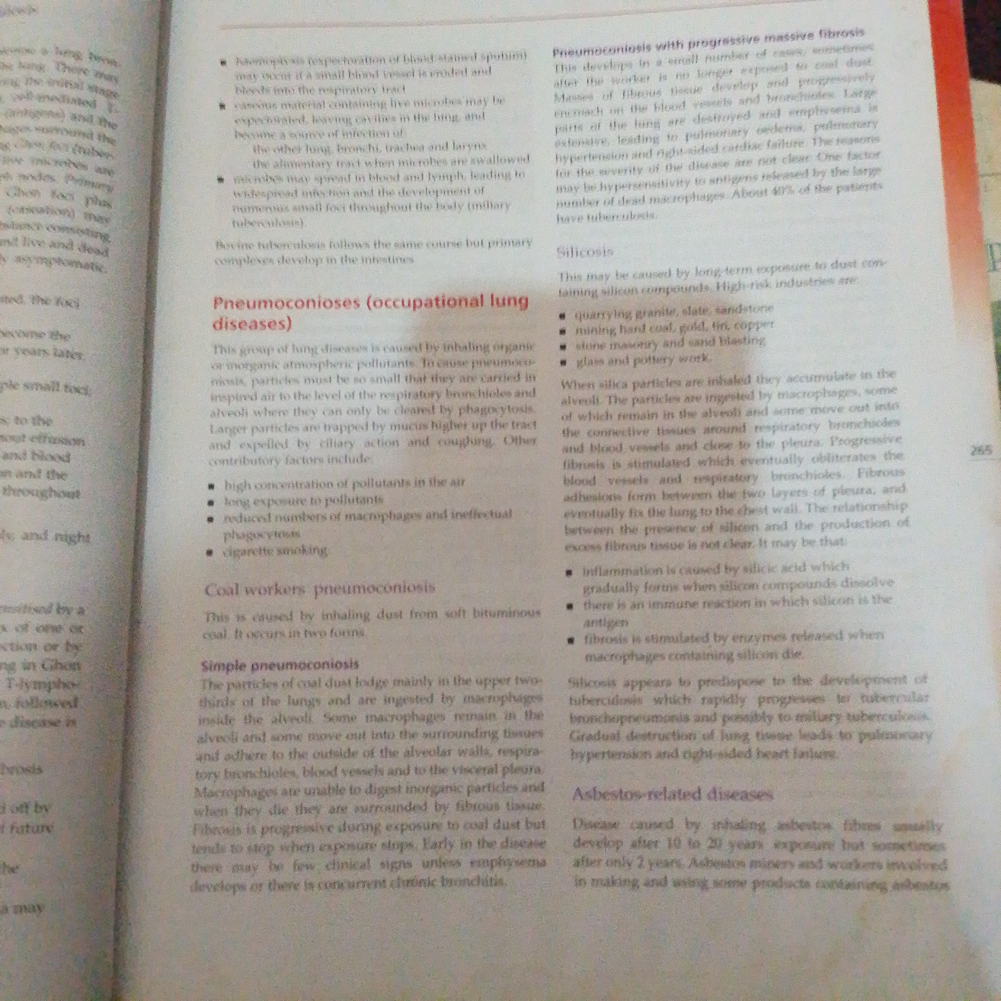 The image is a photograph of a page from a textbook. The page discusses lung diseases, specifically pneumoconioses. The text is divided into several sections, including "Pneumoconiosis with progressive massive fibrosis," "Silicosis," "Coal workers' pneumoconiosis," "Simple pneumoconiosis," and "Asbestos-related diseases." The text is in English and appears to be academic in nature. The background is a plain, light-colored surface, consistent with a book page. There is no visible information about the city of Jalingo, Nigeria, or any elements that would suggest a connection to that location.