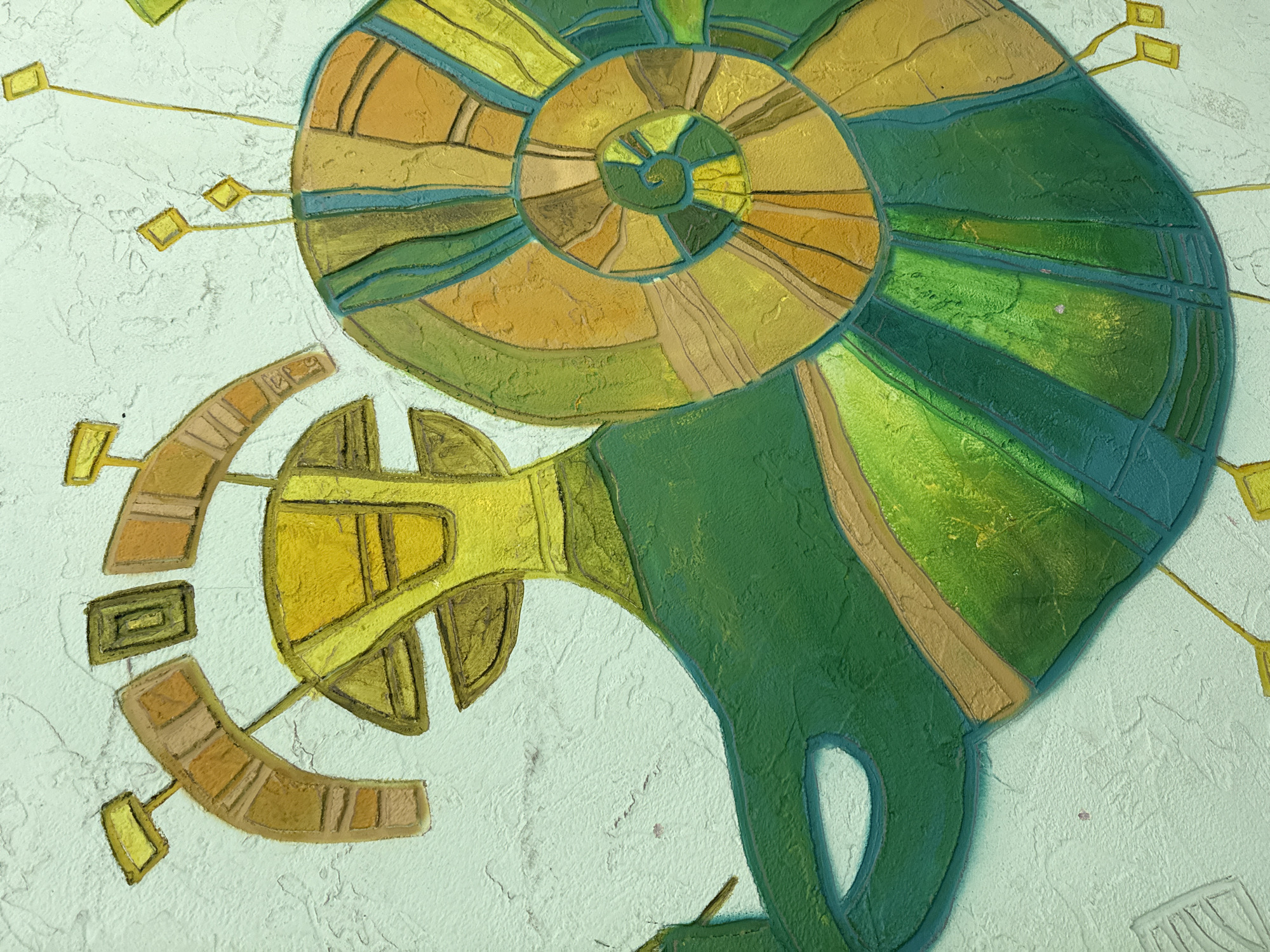 The image depicts an abstract painting or mural. It features a prominent spiral shape, resembling a shell or a horn, composed of segments of varying shades of green and yellow. The segments are delineated by textured lines, creating a mosaic-like effect. Radiating from the spiral are linear elements ending in small, square or rectangular shapes. To the left of the spiral, there is a stylized, deconstructed horn-like form. The background is a textured, off-white surface.
There is no information in the image to suggest that the image is in Moscow, Russia.
