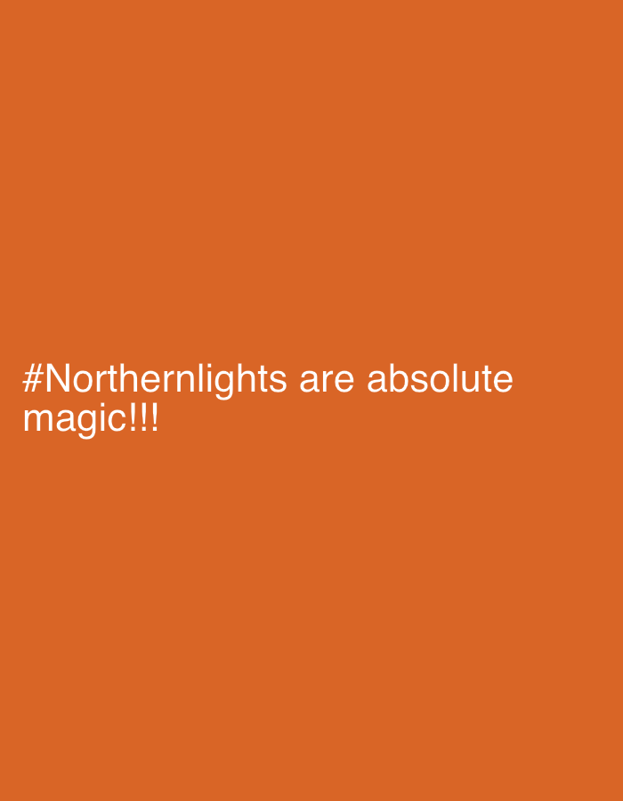 The image shows a solid orange background with the text "#Northernlights are absolute magic!!!" in white. There are no identifiable elements indicating a location or city.