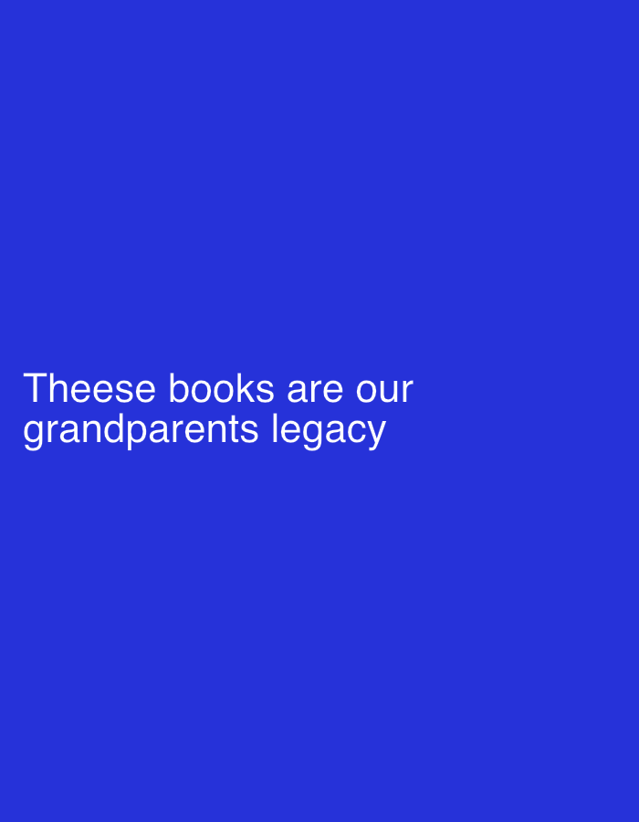 The image is a blue background with white text in the lower left corner. The text reads "Theese books are our grandparents legacy". The scene is simple and direct, with no additional visual elements to suggest a specific setting or time of day. The text is the sole focus, conveying a message about inheritance and family history.