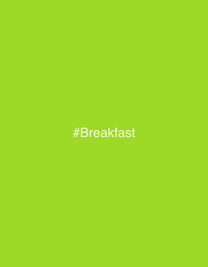 The image is a photograph with a solid bright green background. In the center of the image, written in white text, is the hashtag "#Breakfast". There are no people, objects, or any discernible environmental features present in the image. The location in the city of Rafin Par, Nigeria, is not identifiable from the visual information provided.