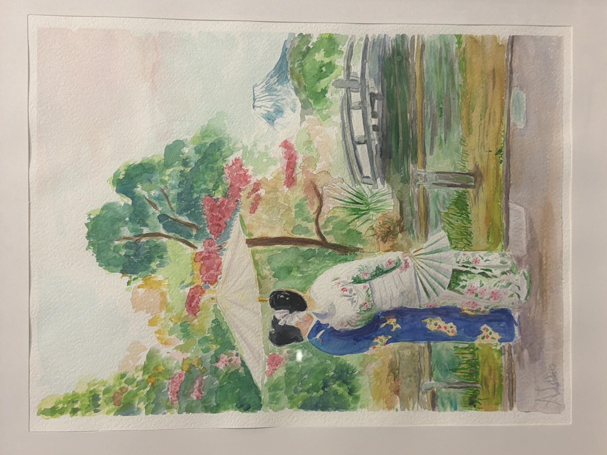 This is a watercolor painting of two individuals in traditional Japanese attire, kimonos, standing under a parasol in a garden. One person is wearing a blue kimono with floral patterns, and the other is in a white kimono with similar floral designs and is holding a fan. In the background, there is a lush garden with trees, flowers, a body of water, a bridge, and Mount Fuji in the distance. The sky has a soft pink hue. The painting is signed in the bottom left corner. There is no discernible information within the image that suggests a location in the city of Elche/Elx, Spain.